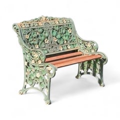 A Coalbrookdale cast iron garden bench