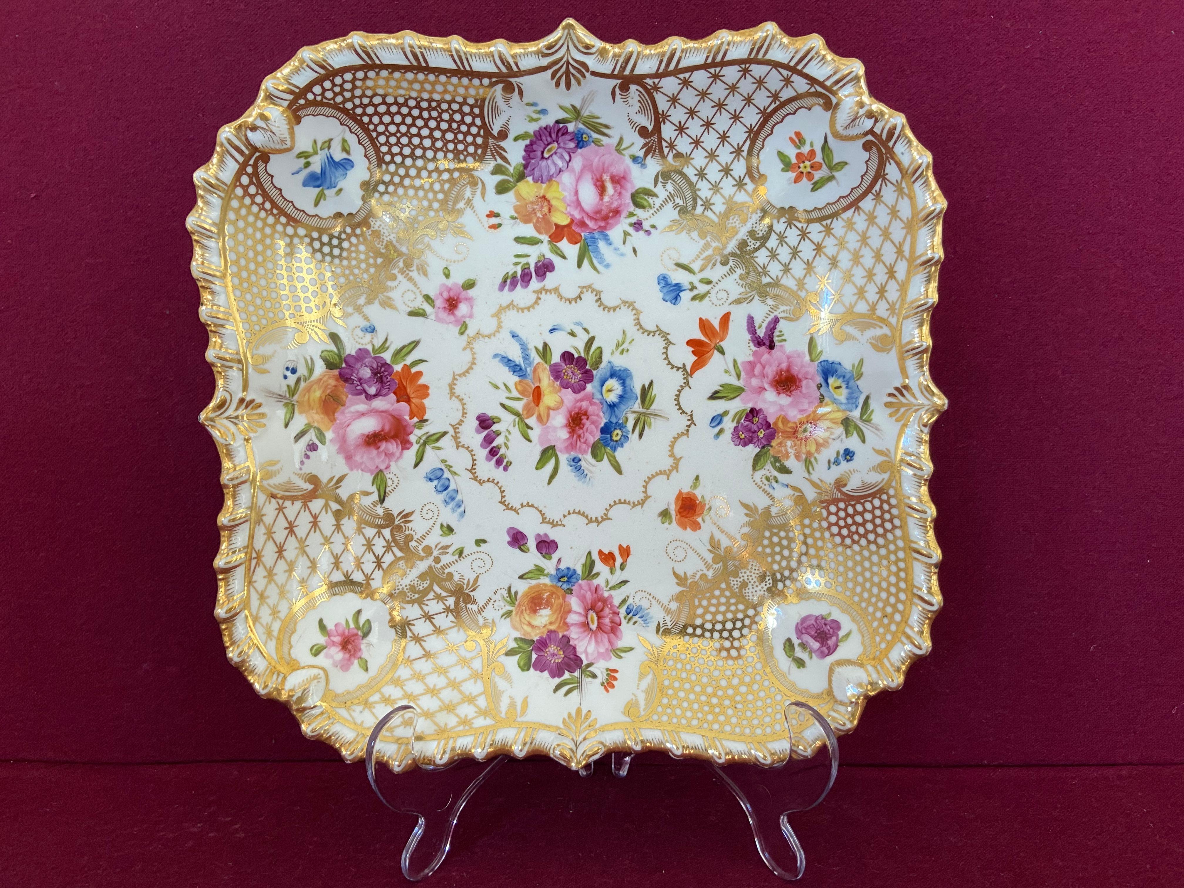 A Coalport 'Union' shape dessert dish c.1820-1830. Finely decorated with flowers and profusely gilded.

Condition: Excellent. Minor wear from use.

Similar dessert wares are illustrated on plates 138/139 in Geoffrey Godden's book on Coalport