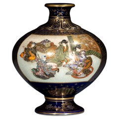 A cobalt-blue Satsuma vase depicting courtly scenes, signed Kinkozan