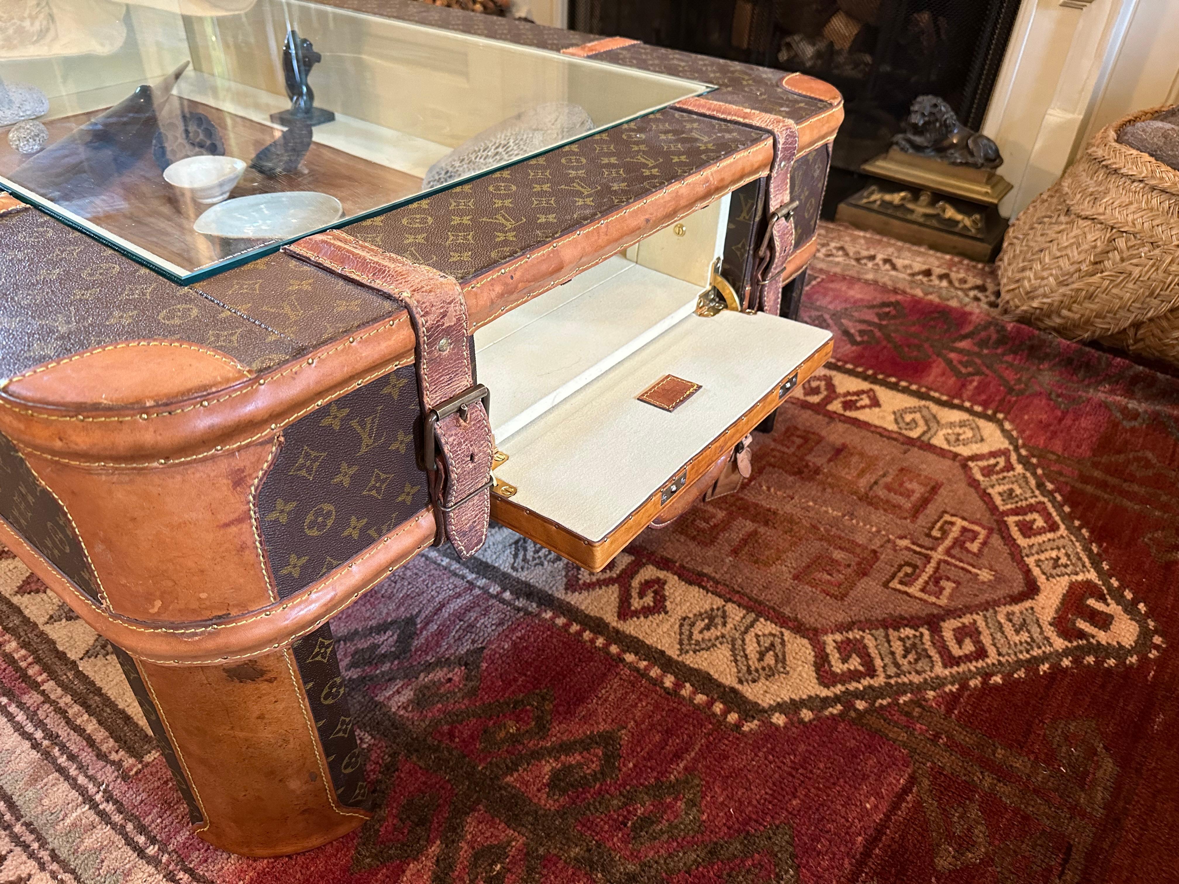 A coffee table made from vintage Louis Vuitton luggage For Sale 1