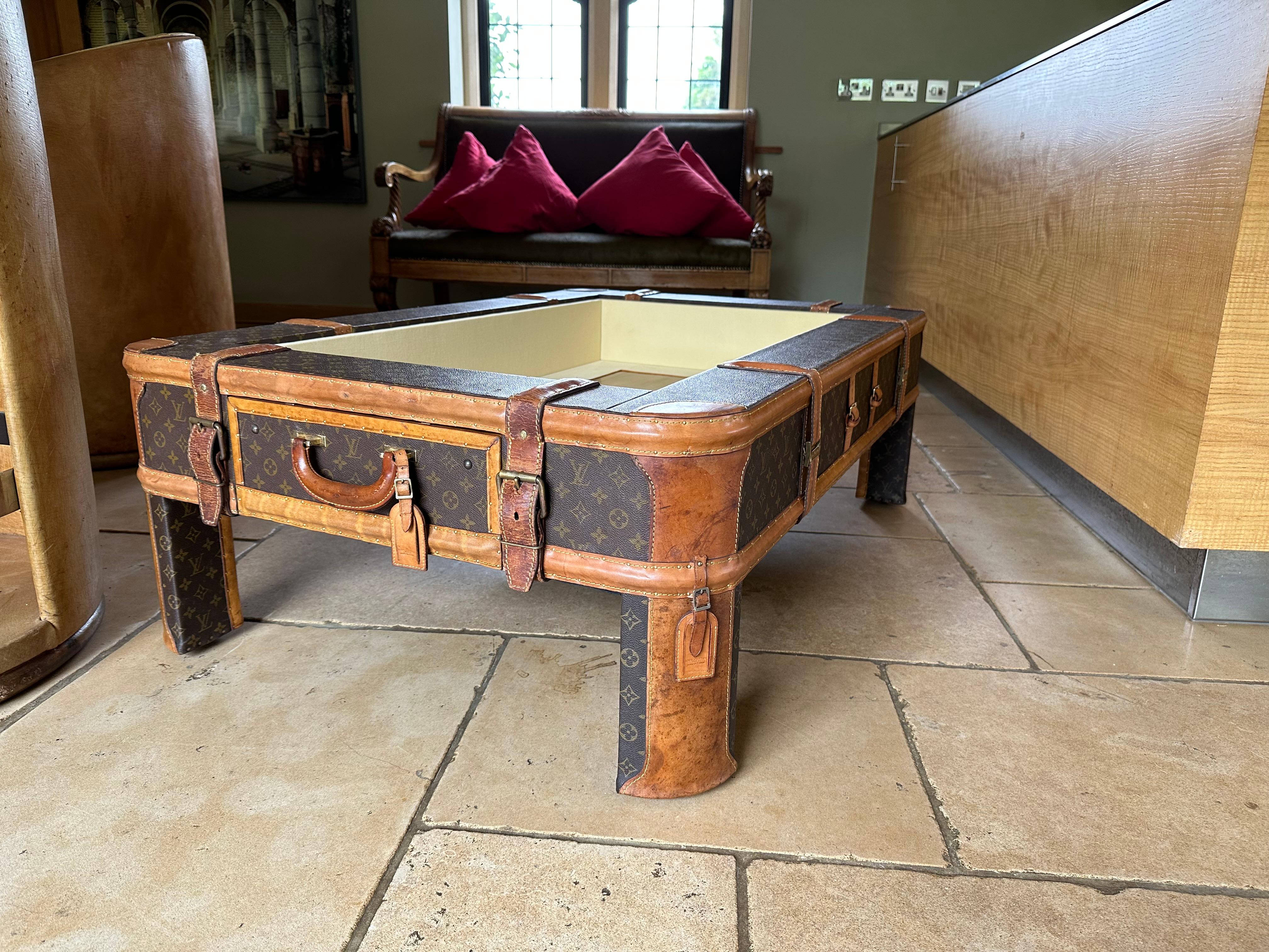 A coffee table made from vintage Louis Vuitton luggage For Sale 2