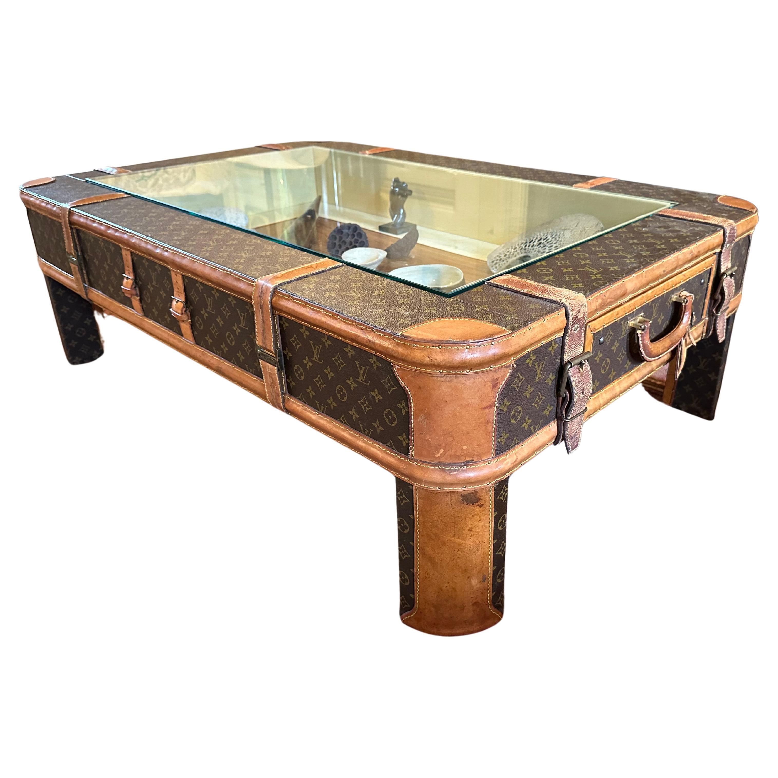 A coffee table made from vintage Louis Vuitton luggage For Sale