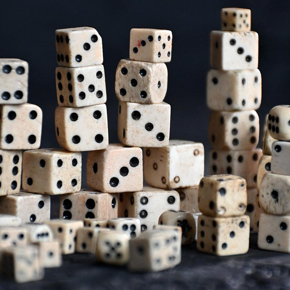 A collection of 19th century bone dice 
This collection of 19th century hand carved bone dice consists of 62 units of various shapes and sizes. With a few prisoners of war examples in this collection. 

Size in inches: h 0.5” x w 0.5” x D 0.5” to