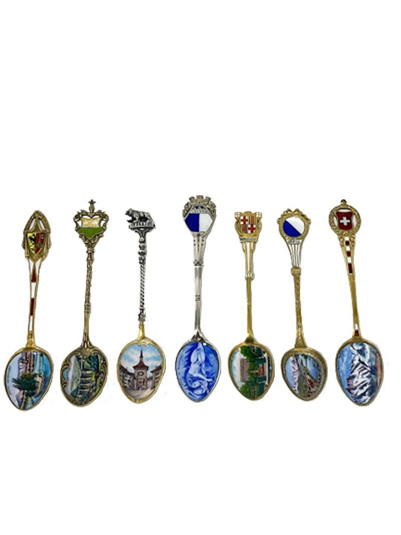 A collection of 7 Silver and enamel spoons from various places in Europe. 

Silver 800 gold plated

* Liberte et Patrie, scene of Lausanne
* Berne, Silver handle with bear/ gilt spoon
* Luzern, Lion de Lucerne
* Barcelona
* Zurich
* Station