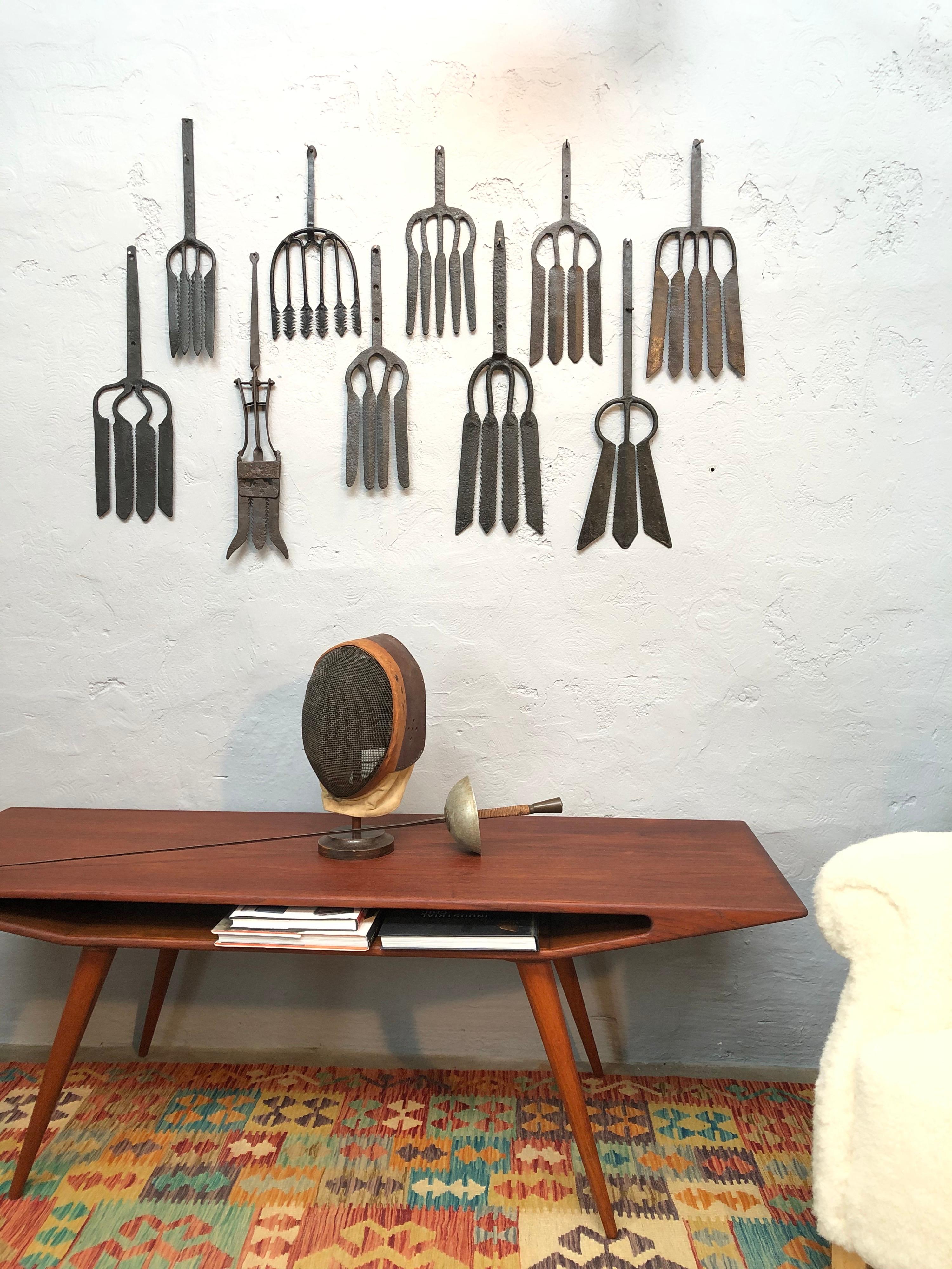 A collection of 10 wrought iron eel forks from the 18th century. 
Extremely decorative and each one unique. 
Each one is a work of art. 
Sizes vary from 36 cm to 63 cm. 
Would look amazing in a fish restaurant, bar, club or even in your home.
In