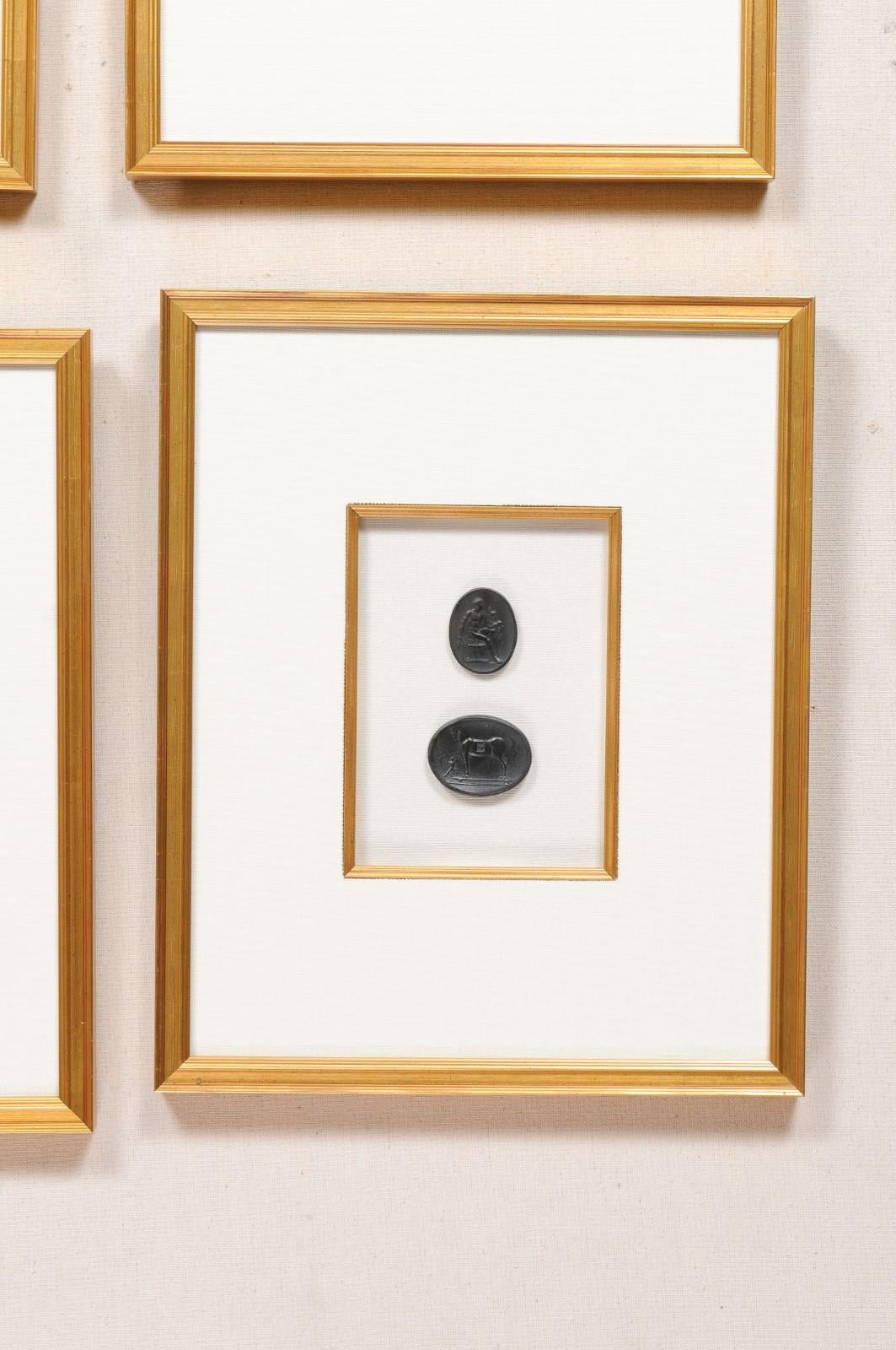 Contemporary Collection of Black Intaglio Seals, Displayed Within Custom Golden Wood Frames
