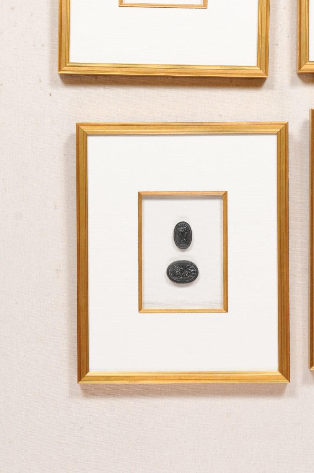 Collection of Black Intaglio Seals, Displayed Within Custom Golden Wood Frames 1