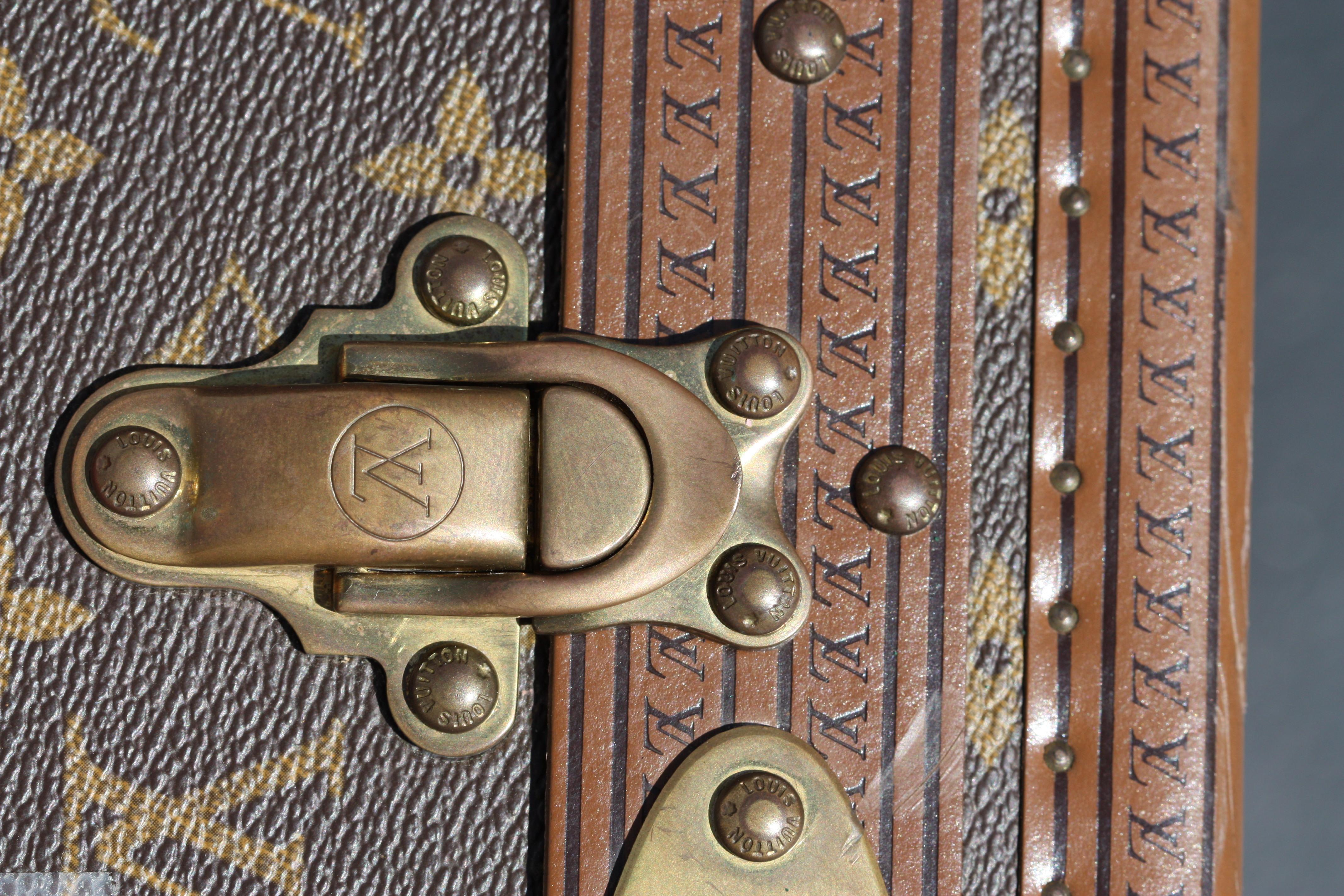 A Collection of Four Louis Vuitton Suitcases with monogram pattern, leather edging, brass locks, catches, corners and rivets
each lock stamped Louis Vuitton Made in France. 
Measures: Height of the largest 20 in.; width 30 1/2 in.; depth 10