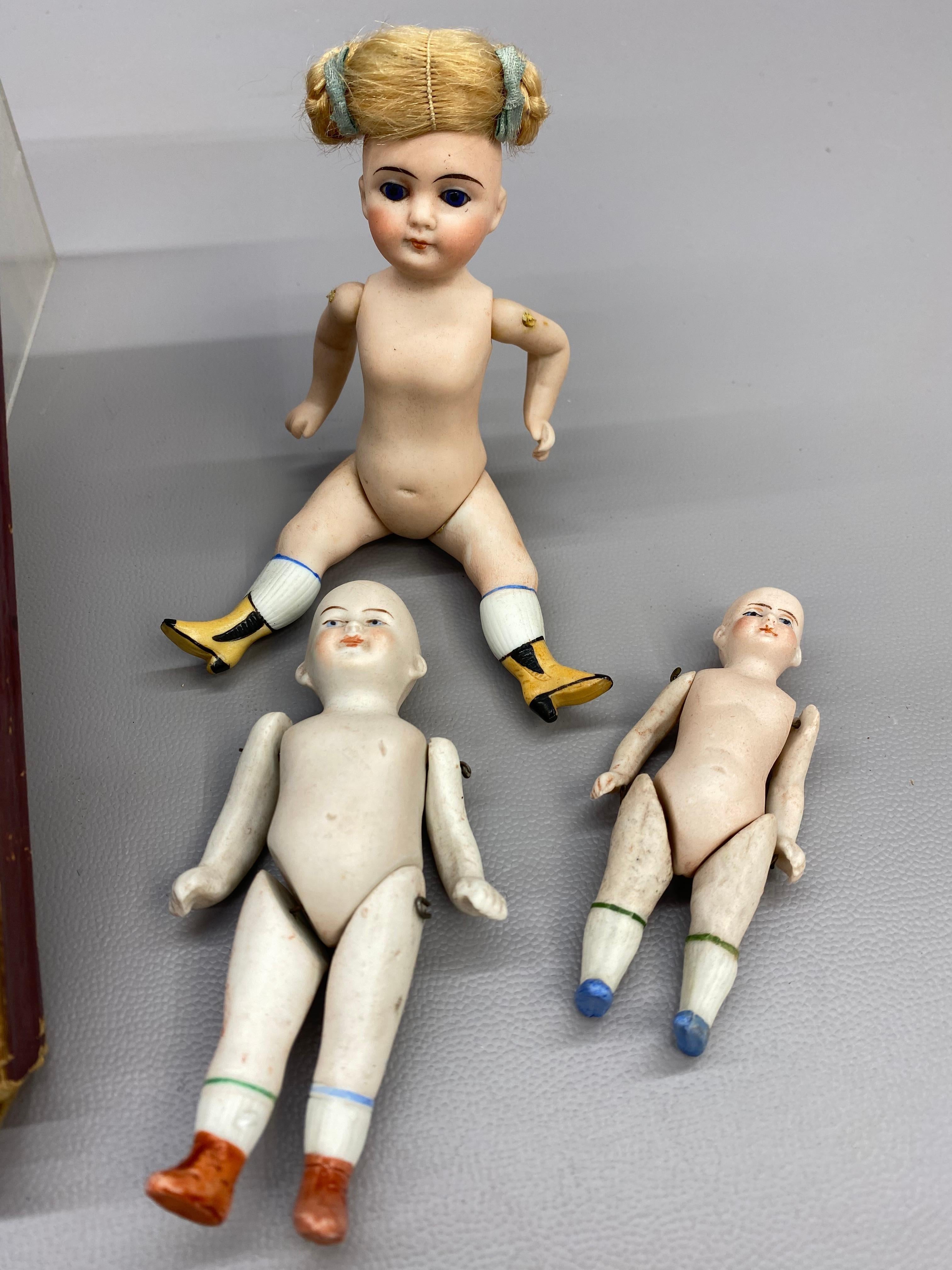 A Collection of German Bisque Hand-Painted Miniature Dolls, Five 1