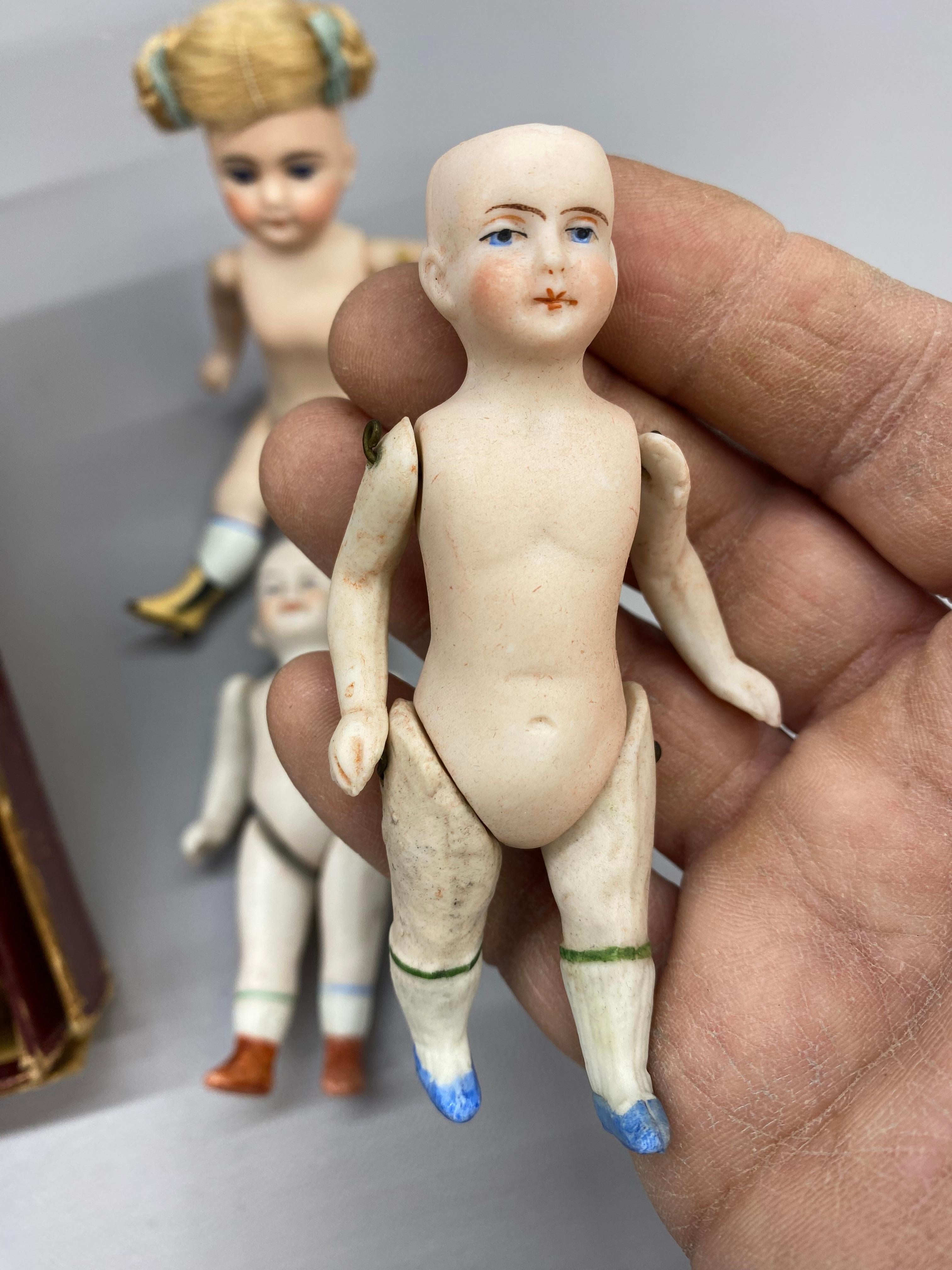 A Collection of German Bisque Hand-Painted Miniature Dolls, Five 2