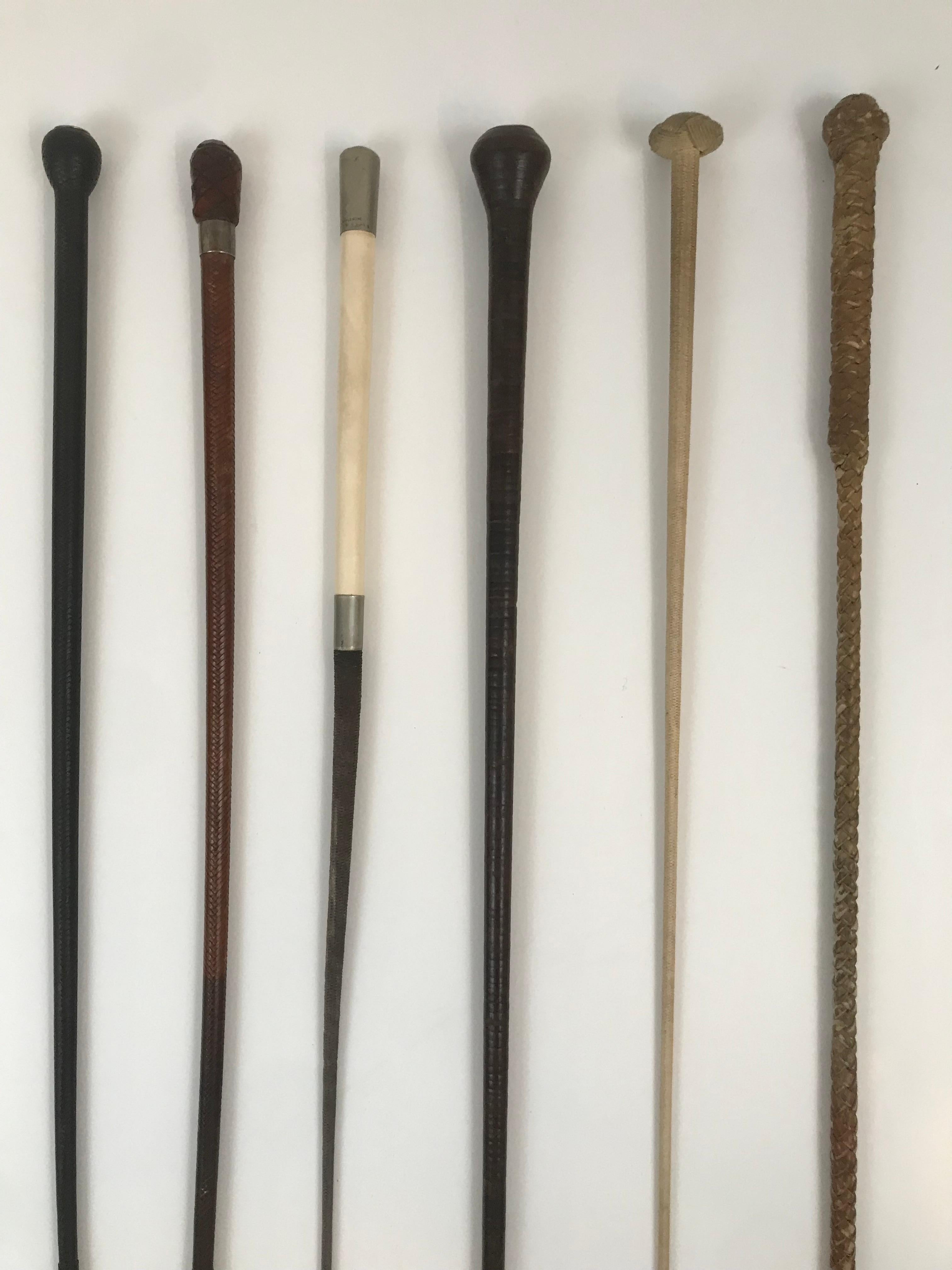 A collection of rare riding crops and swagger sticks dating from the mid 1800's through the contemporary era. From the left in photo one descriptions are as follows. 

1. 2000's Hermes riding crop in dark brown leather in unused excellent