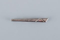 A collection of ten Danish tie pins in sterling silver and gold-plated metal.