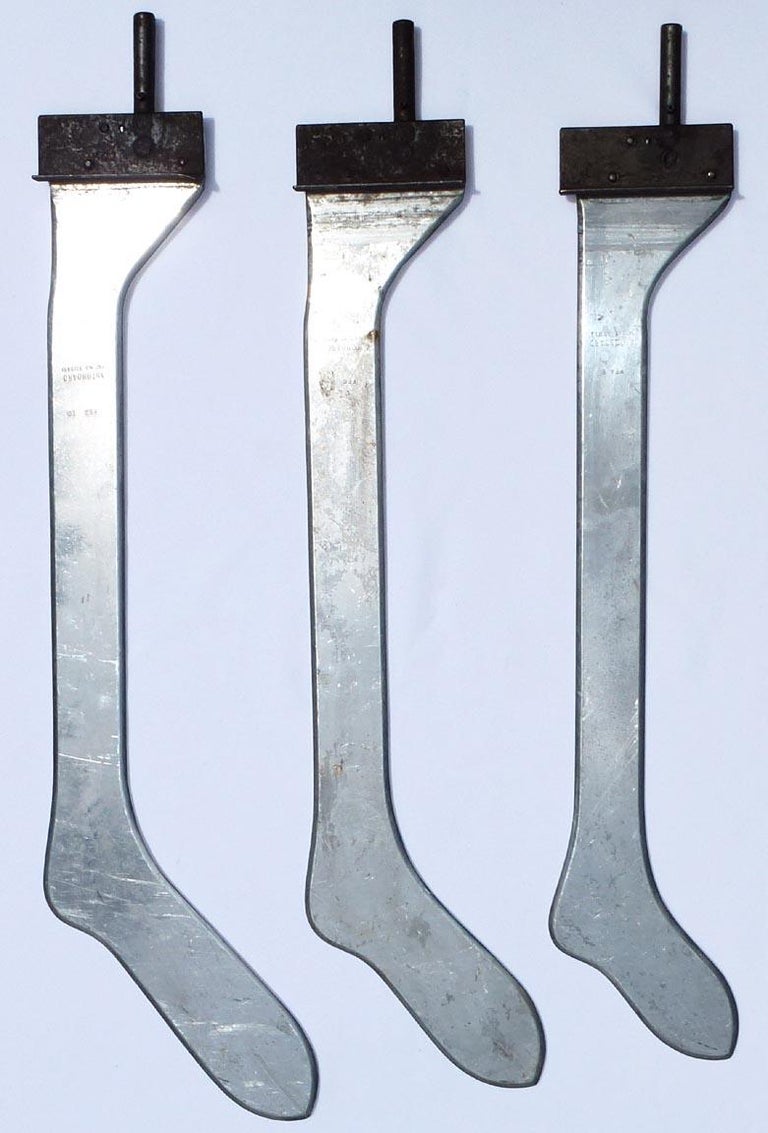 A collection of three different sized metal industrial sock or stocking