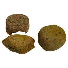 A collection of three embroidered Afghan hats