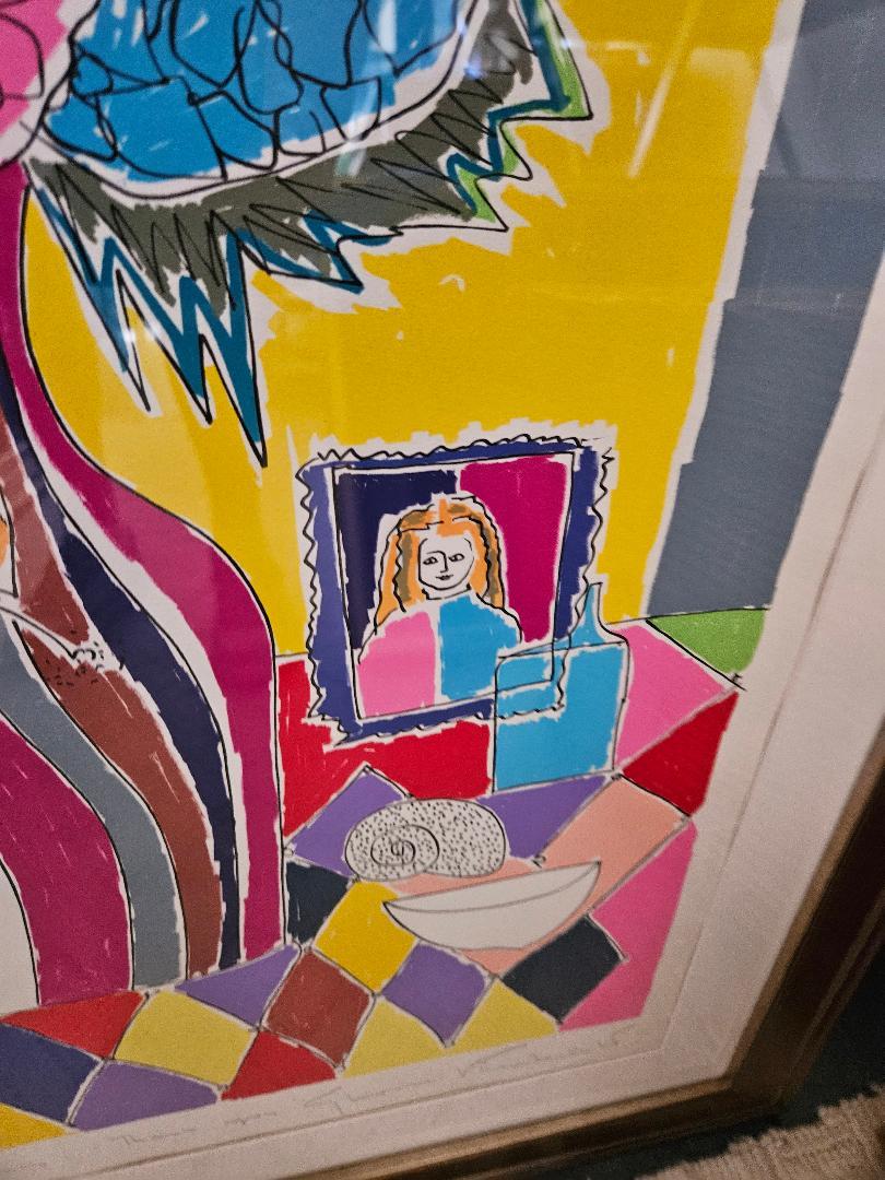 A charming and colorful vase of flowers on paper under glass pencil signed by Gloria Vanderbilt, the 1970's lithograph is an artist proof, a gift to a personal friend of Gloria's, in a silver leaf frame.  37.5 inches high, 30.5 inches wide, 