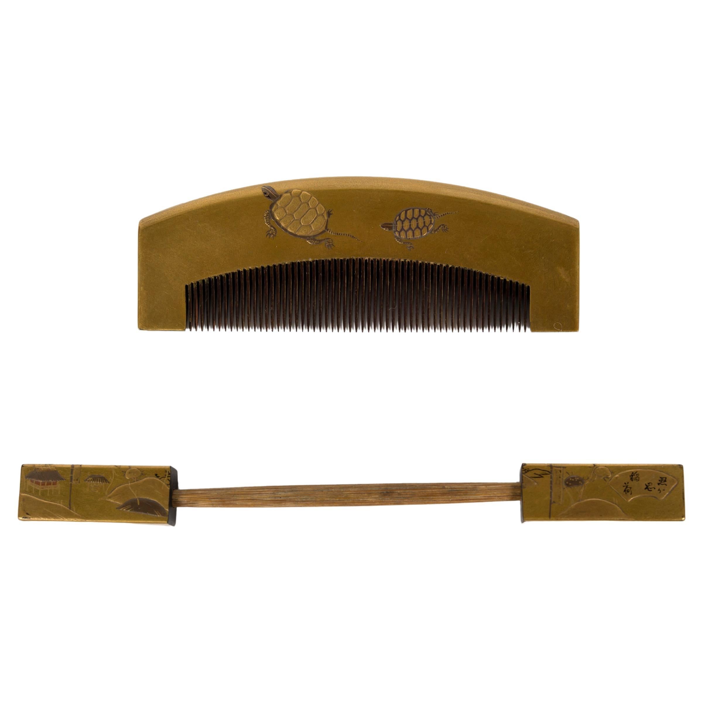 A comb and hairpin in gold lacquer decorated with two swimming turtles