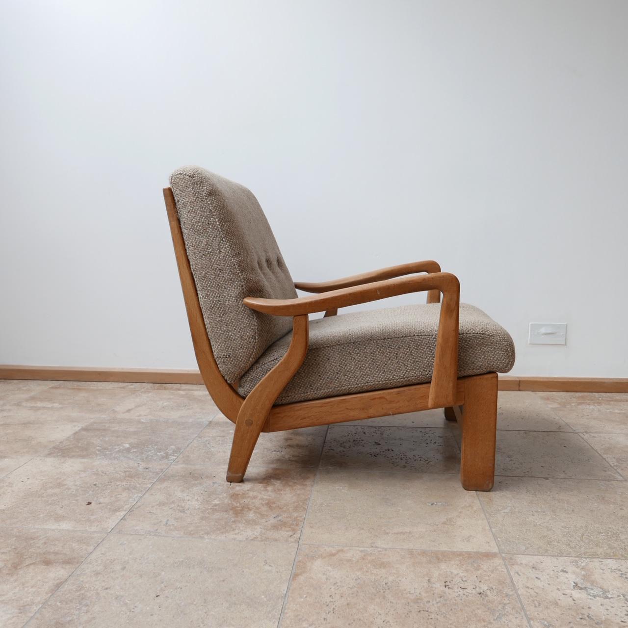 A comfy and extremely stylish armchair by French designers Guillerme et Chambron.

French, circa 1960s.

Original upholstery which is perfectly usable but can easily be replaced as they consist of two cushions.

Great form, one of the most