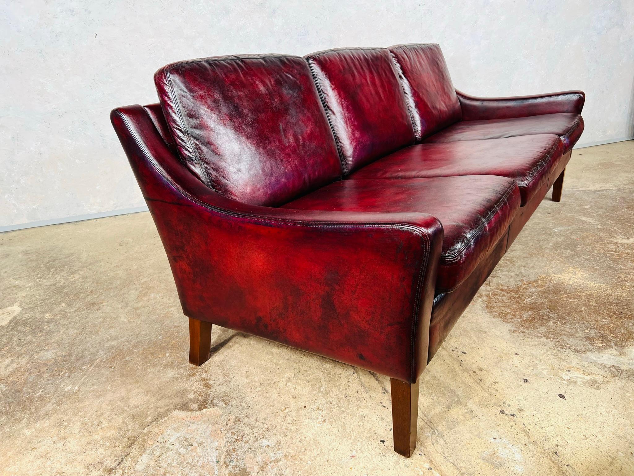 A Compact Vintage Danish 1970s Deep Red Three Seater Leather Sofa For Sale 1