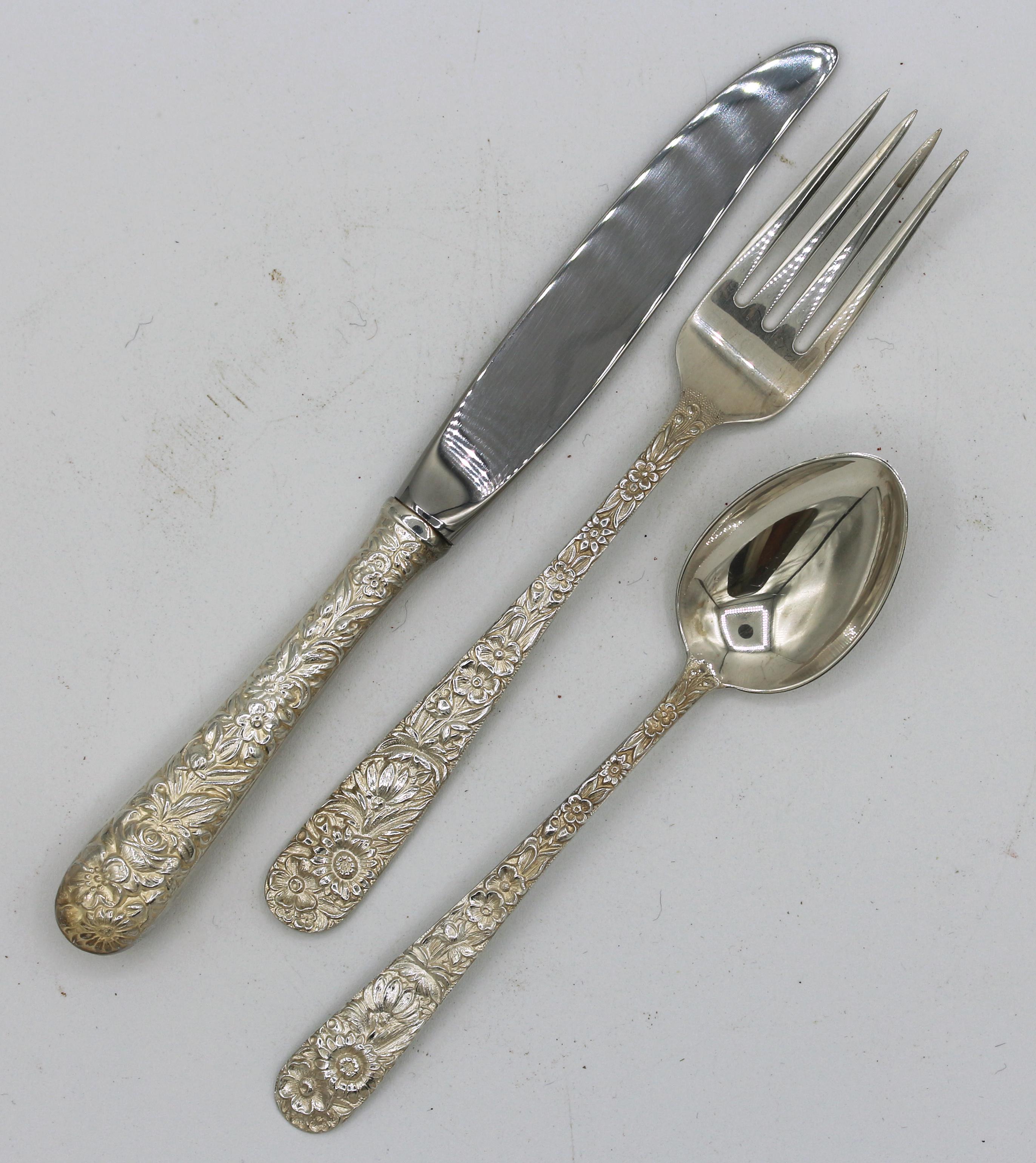 A complete Kirk repousse child's dinner service: knife, fork, and spoon (latter two monogramed 