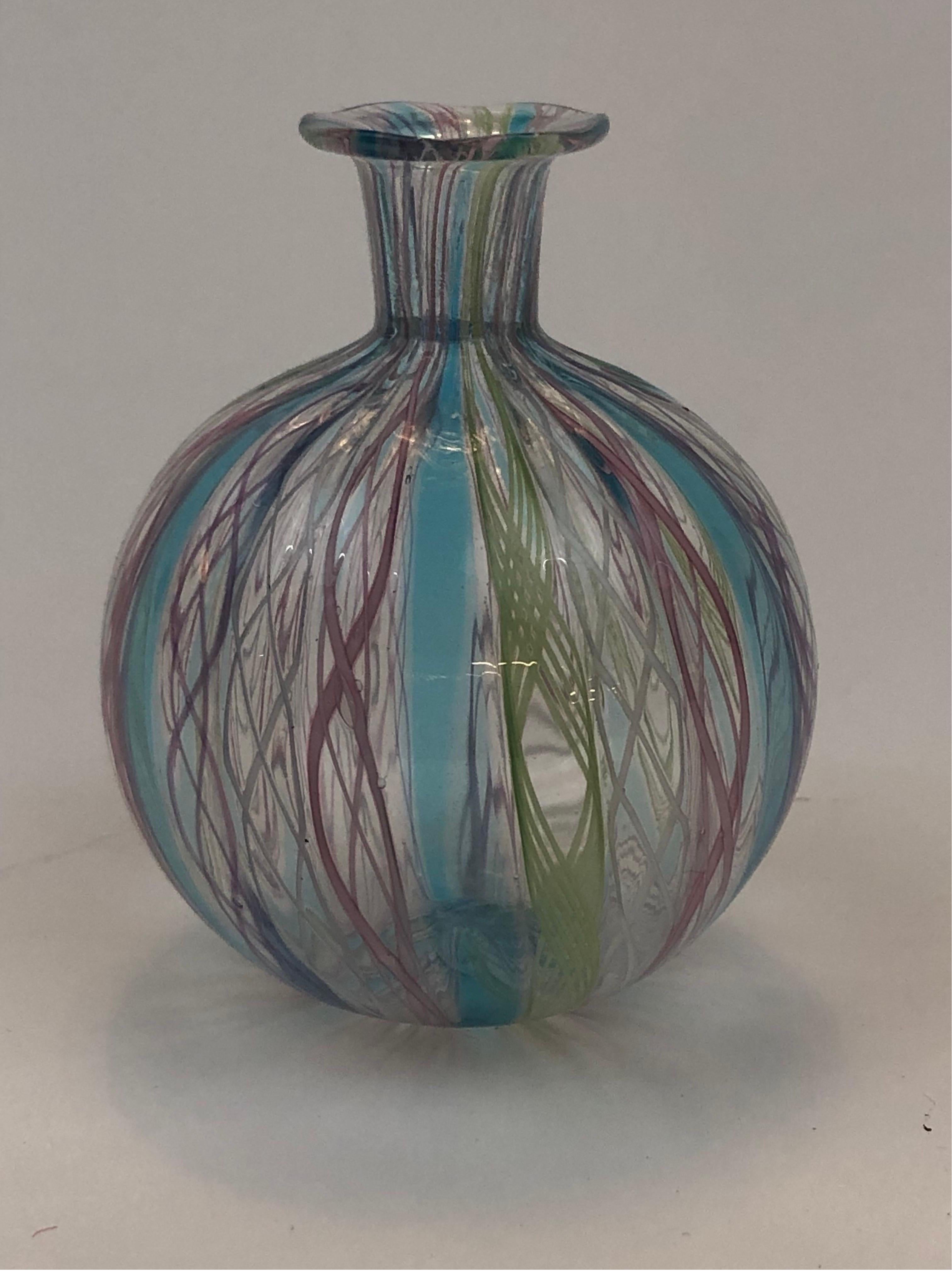 A complicated hand blown Zanfirico, Murano miniature bud vase / perfume bottle striped in fused glass with multi sections of twisted braided glass. No chips breaks or cracks and in excellent overall condition.