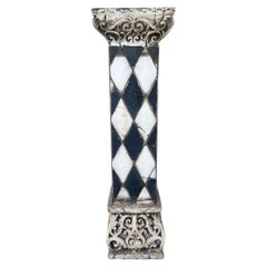 A Composition faux marble black and white harlequin patterned jardinere stand.