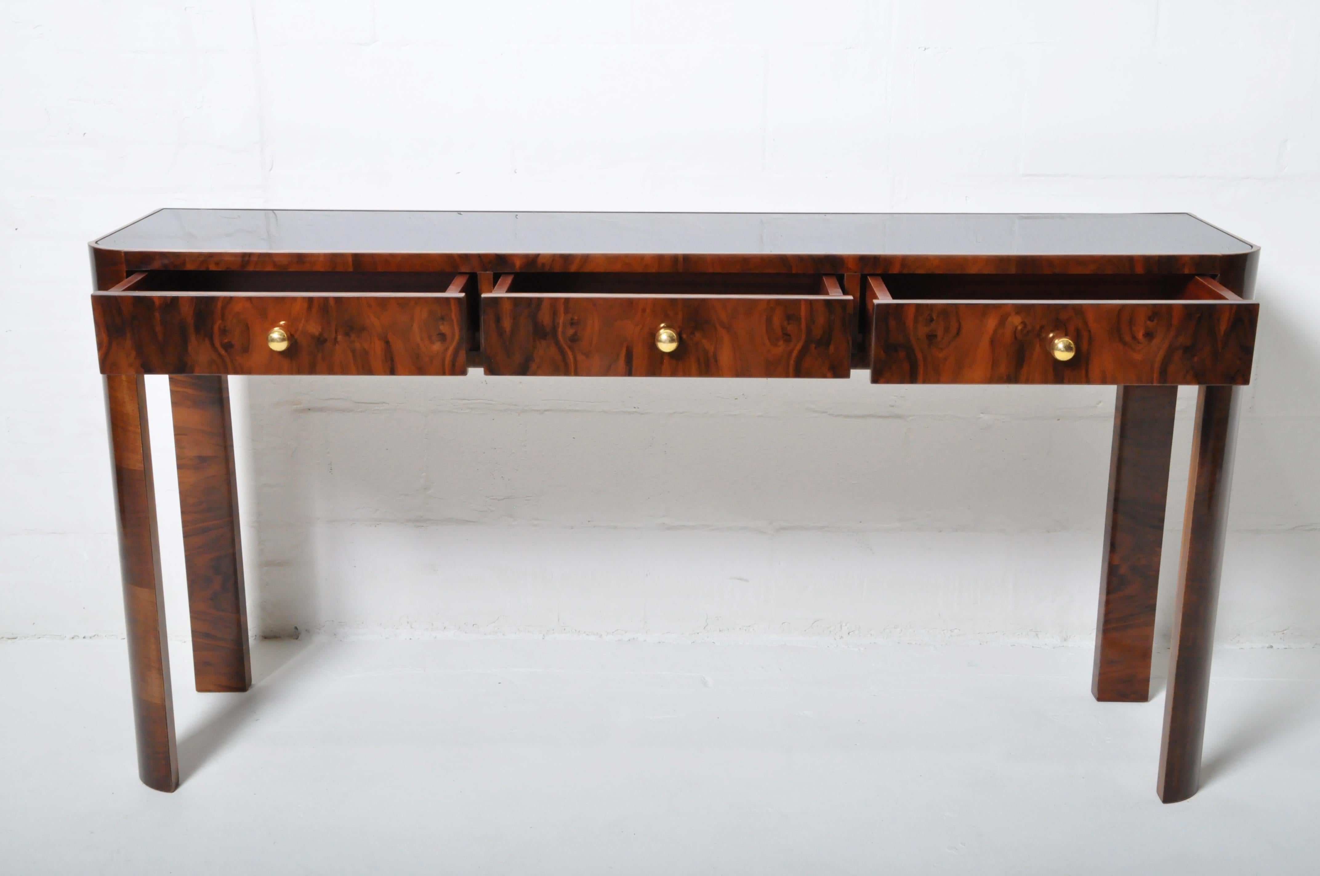 Contemporary Console Table with Three Drawers and a Black Glass Top