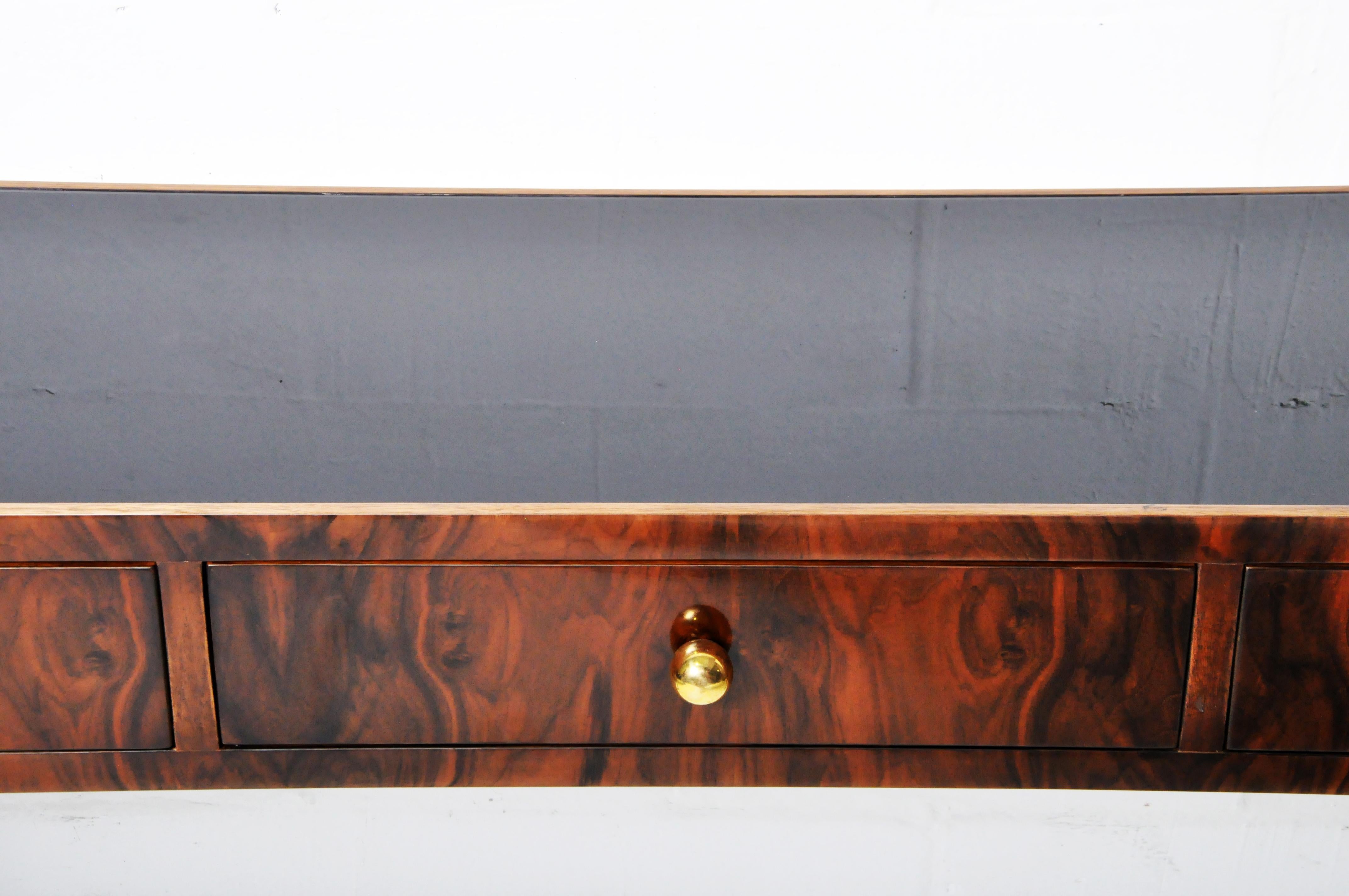Console Table with Three Drawers and a Black Glass Top 1