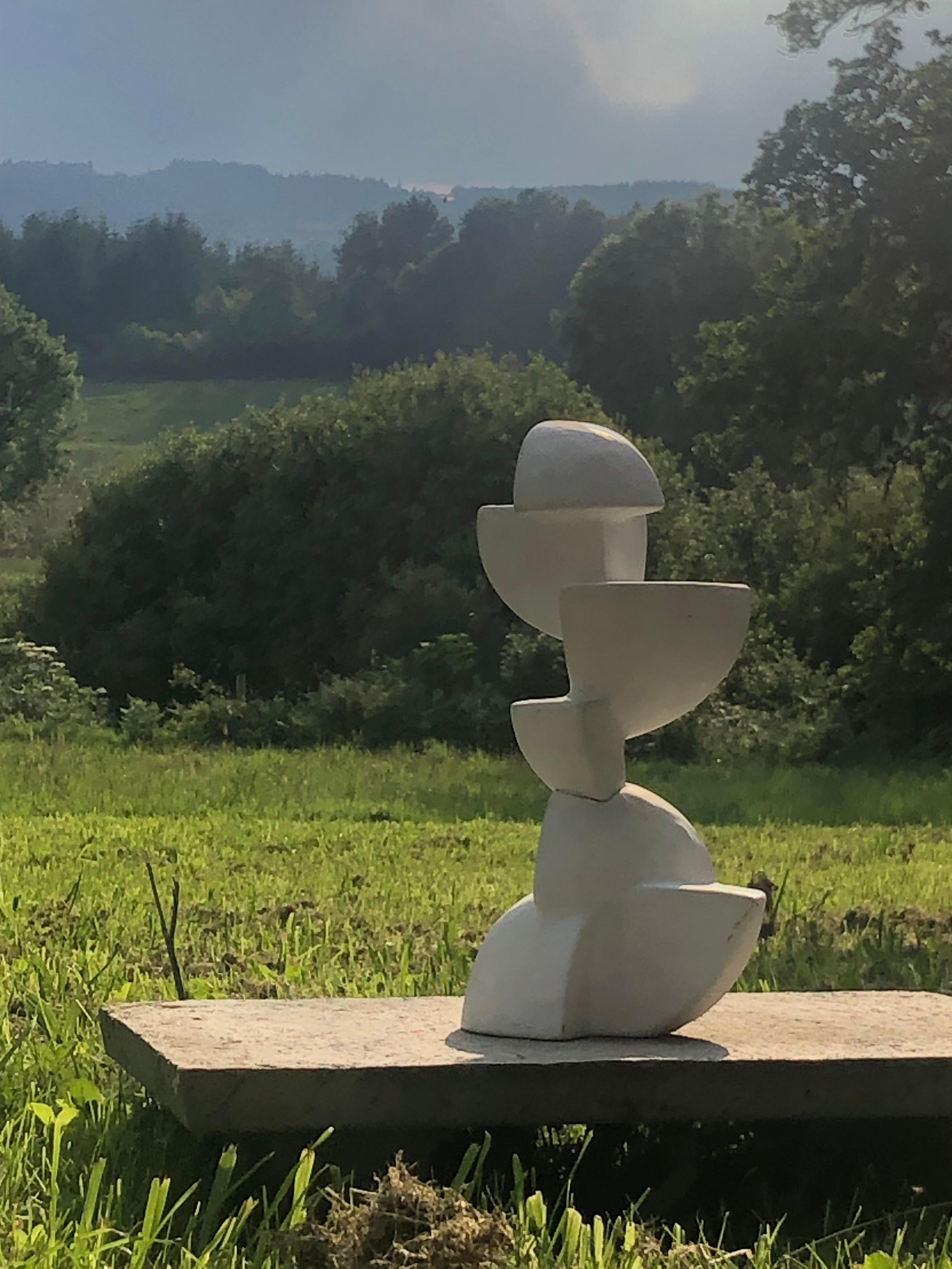 A superb architectural sculpture, Modernist, Free-Form, Geometric Abstraction, an asymmetrical assembly of matte white glazed ceramic quarter-spheres around an invisible vertical axis, forming a geometric construction, unsigned, to be attributed,