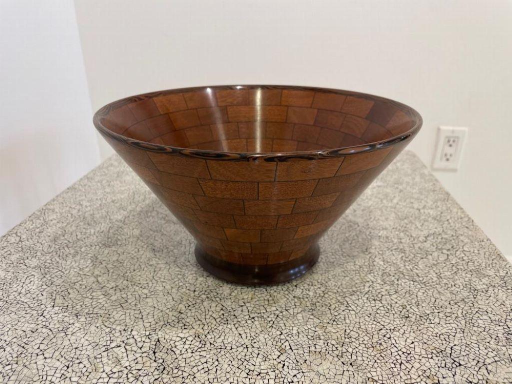 A contemporary turned wood bowl. Made of various marquetry and solid wood. Designed by John Enloth .