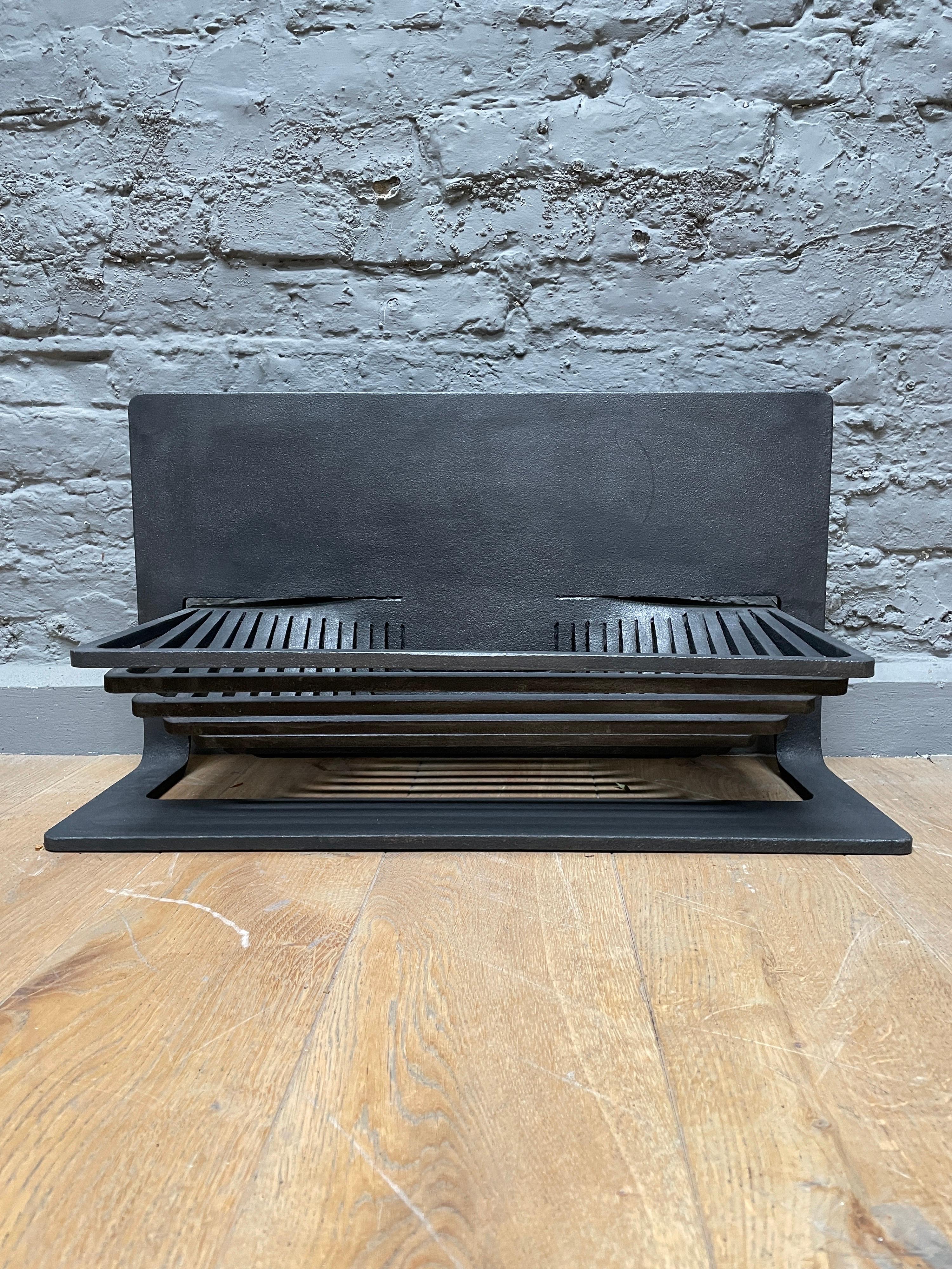 A laser cut fire basket/grate by Stuart Hill. Very similar to the one in the V&A museum London. Cut and made from one piece of steel.