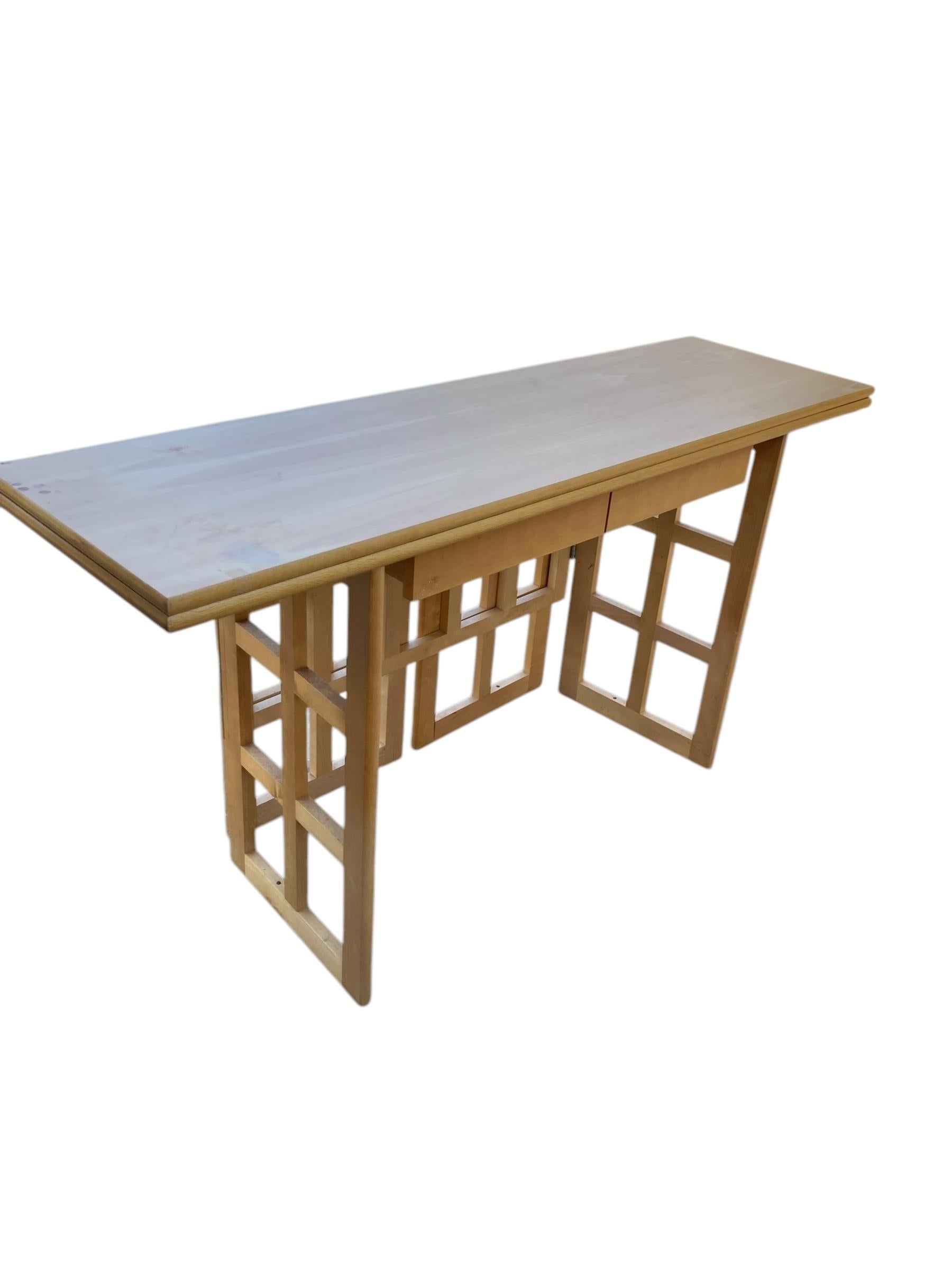 A Contemporary Folding Beechwood Desk with Two Drawers and two Folding Chairs. This practical design can be use for one or two people. It can be used in two sizes to fit into any workspace area and also folds away for easy storage whilst maintaining