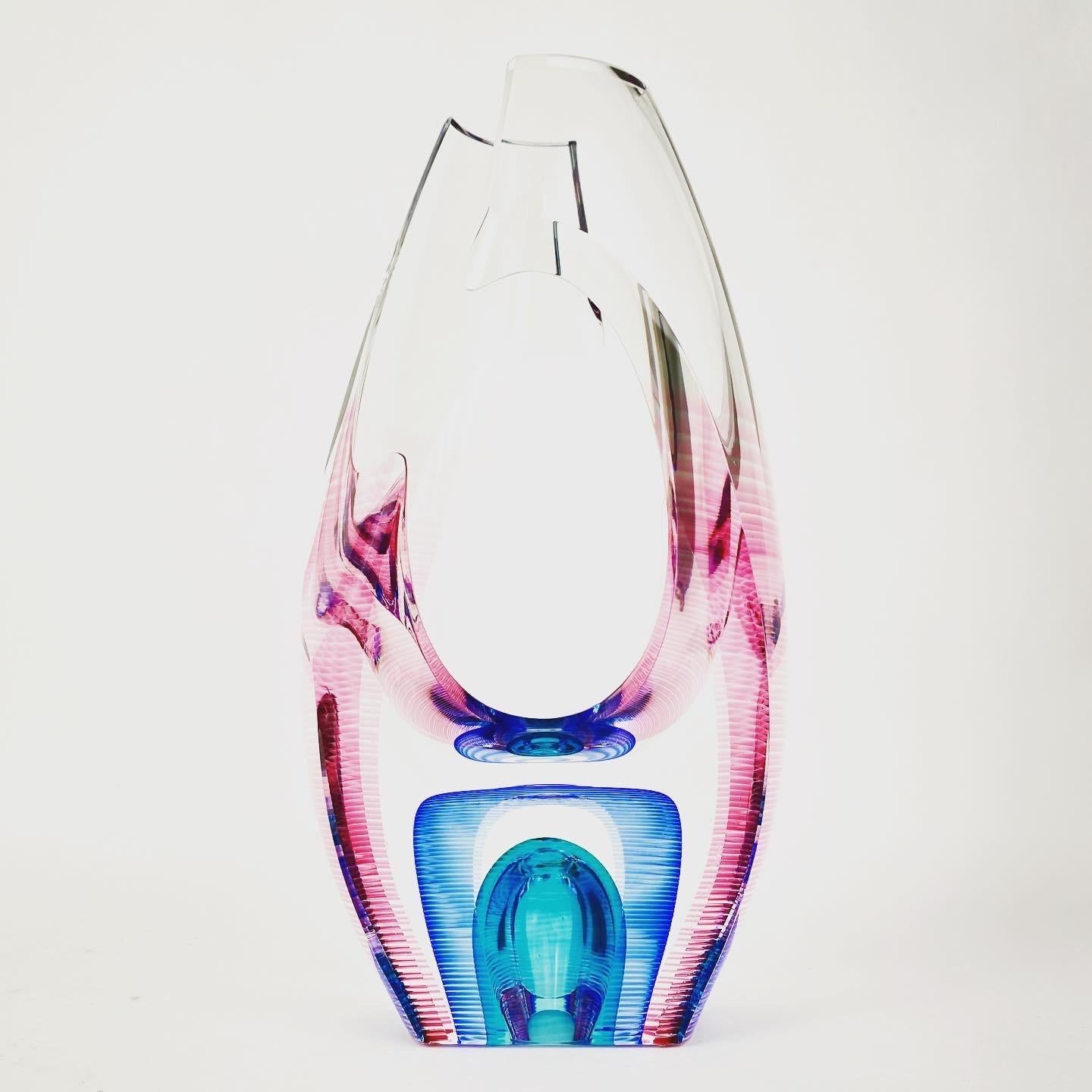 A contemporary American Studio art glass layered cut and polished handcrafted “Vortex” sculptural vessel by, Kit Karbler & Michael David of Blake Street Glass Studio. The vessel is signed on the bottom “Kit Karbler & Michael