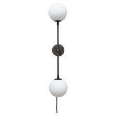 A Contemporary Grey Wall Light in Metal and Opal Glass.