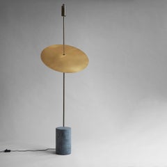 A Contemporary Iron and Brass Floor Lamp.