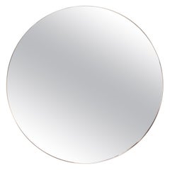 A contemporary Italian large round brass mirror, 21st Century. A contemporary Italian large round brass mirror, 21st Century.
