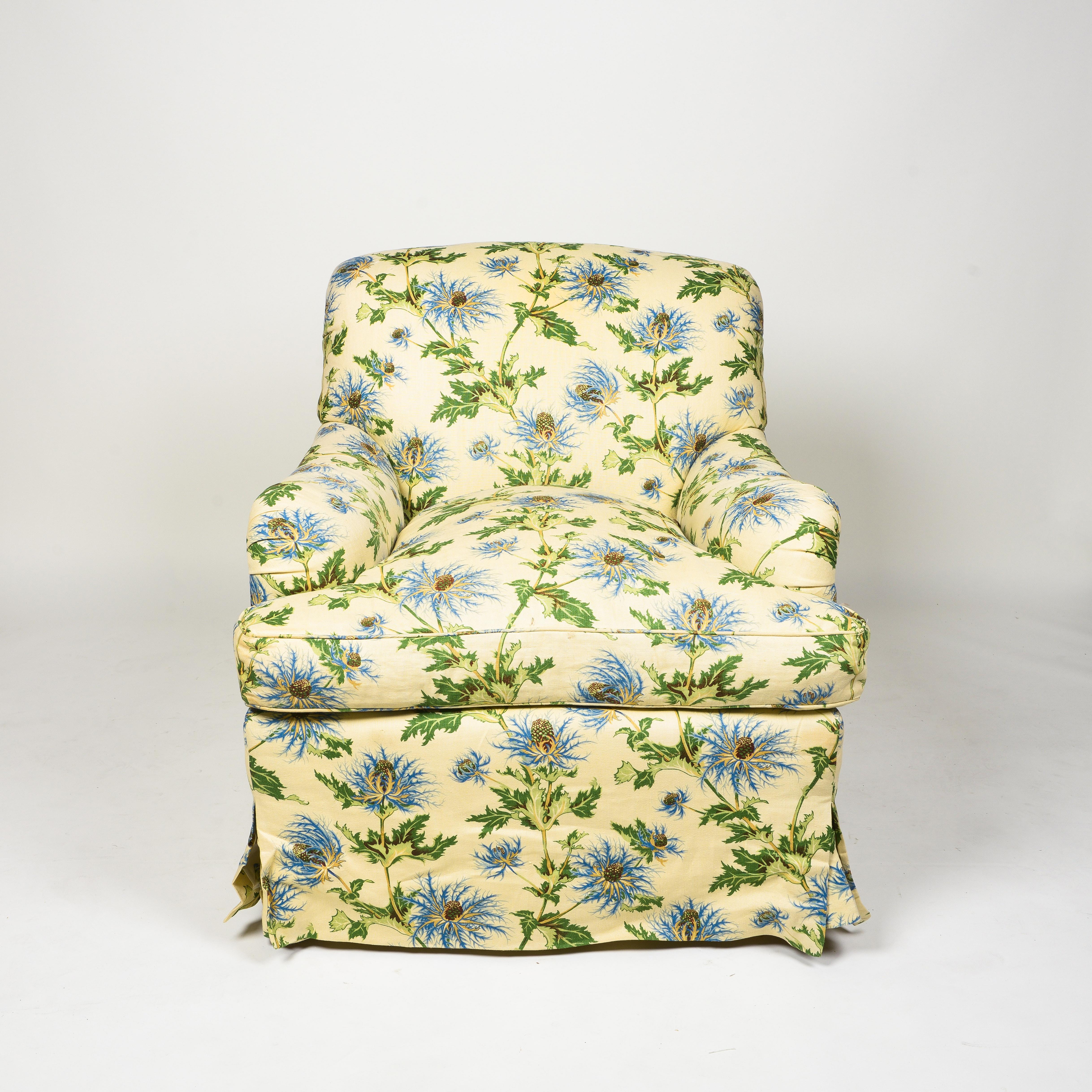 Of generous proportions and extremely comfortable; custom-made with down seat cushion; upholstered with loose seat cushion in a cream linen thistle print.