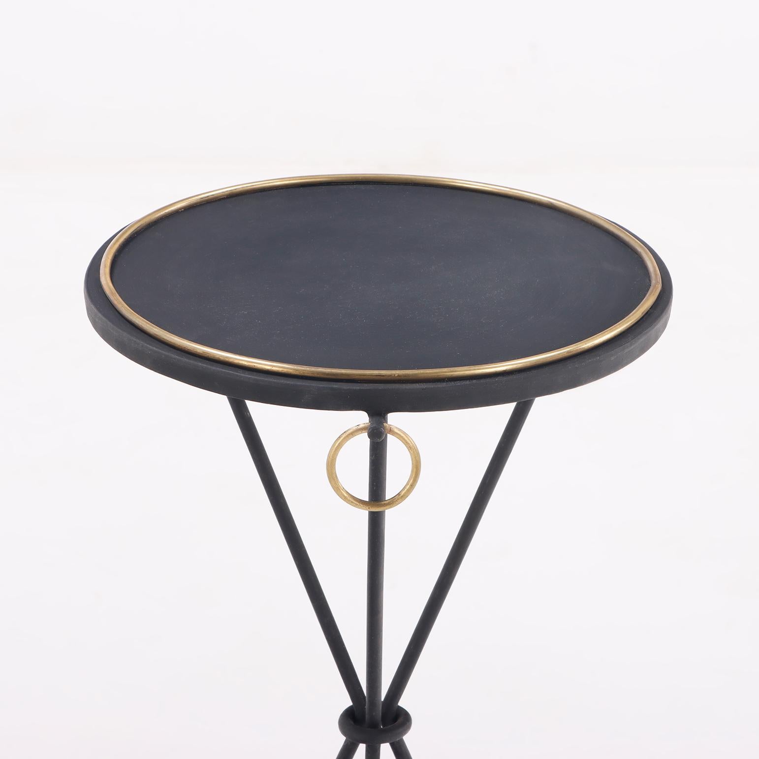 A contemporary pair of wrought iron drink tables having ring decoration.  In Good Condition For Sale In Philadelphia, PA