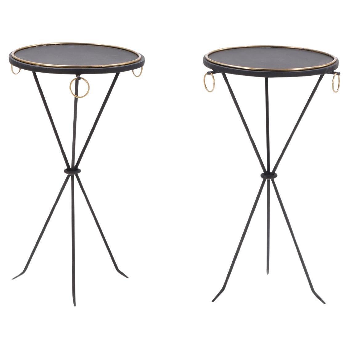 A contemporary pair of wrought iron drink tables having ring decoration. 