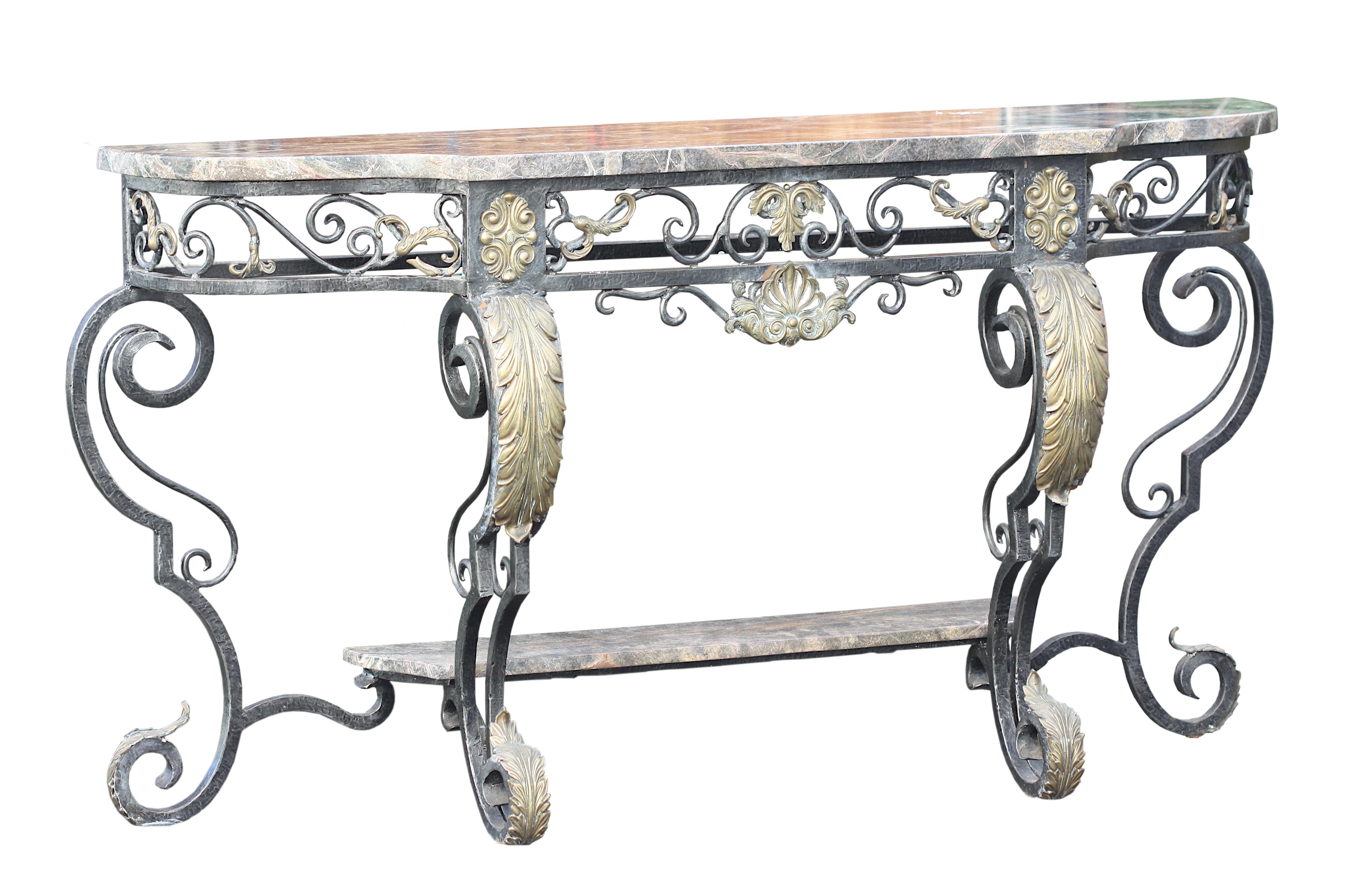 
A Contemporary Steel, Bronze and Marble Console Table
The shaped rectangular top with rounded corners, above an open scroll-work frieze, on-scrolled supports with gilt leaves, joined by a platform marble stretcher. 
60 in. (152.4 cm.) wide, 34 in.