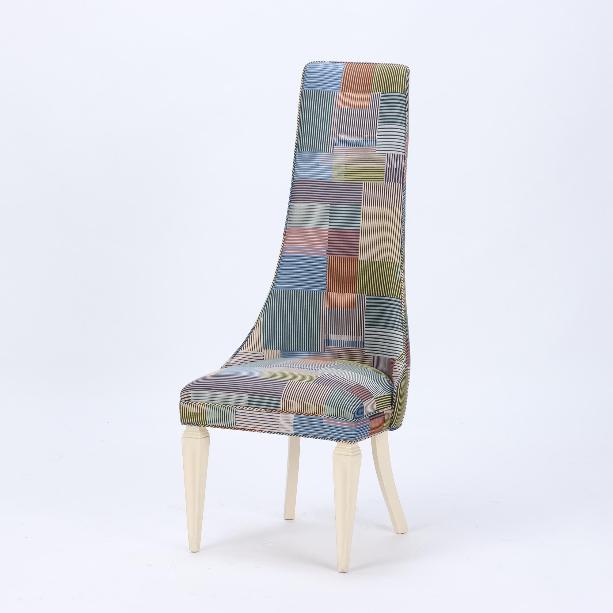 A contemporary tall back side chair covered in Paul Smith fabric.