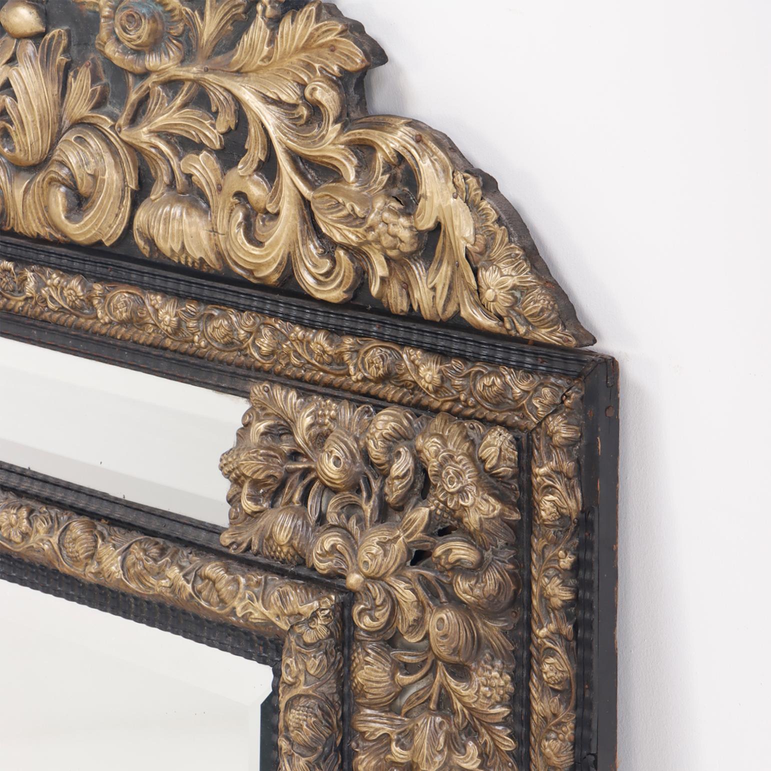 A continental brass repouse cushion mirror circa 1890. In Good Condition In Philadelphia, PA