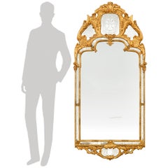 A Continental late 18th century Louis XV Period Giltwood mirror