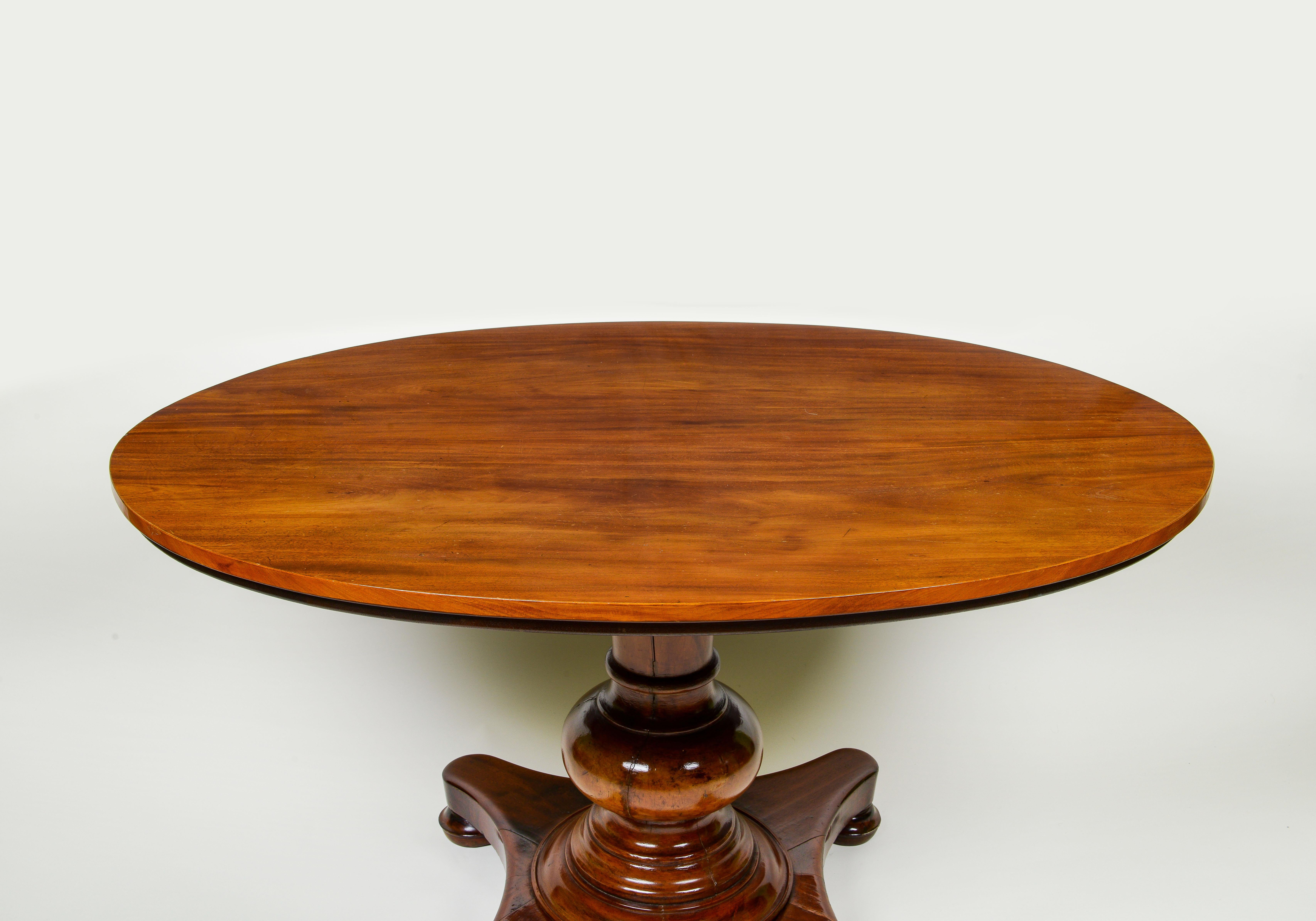 Turned A Continental Mahogany Oval Center Table For Sale