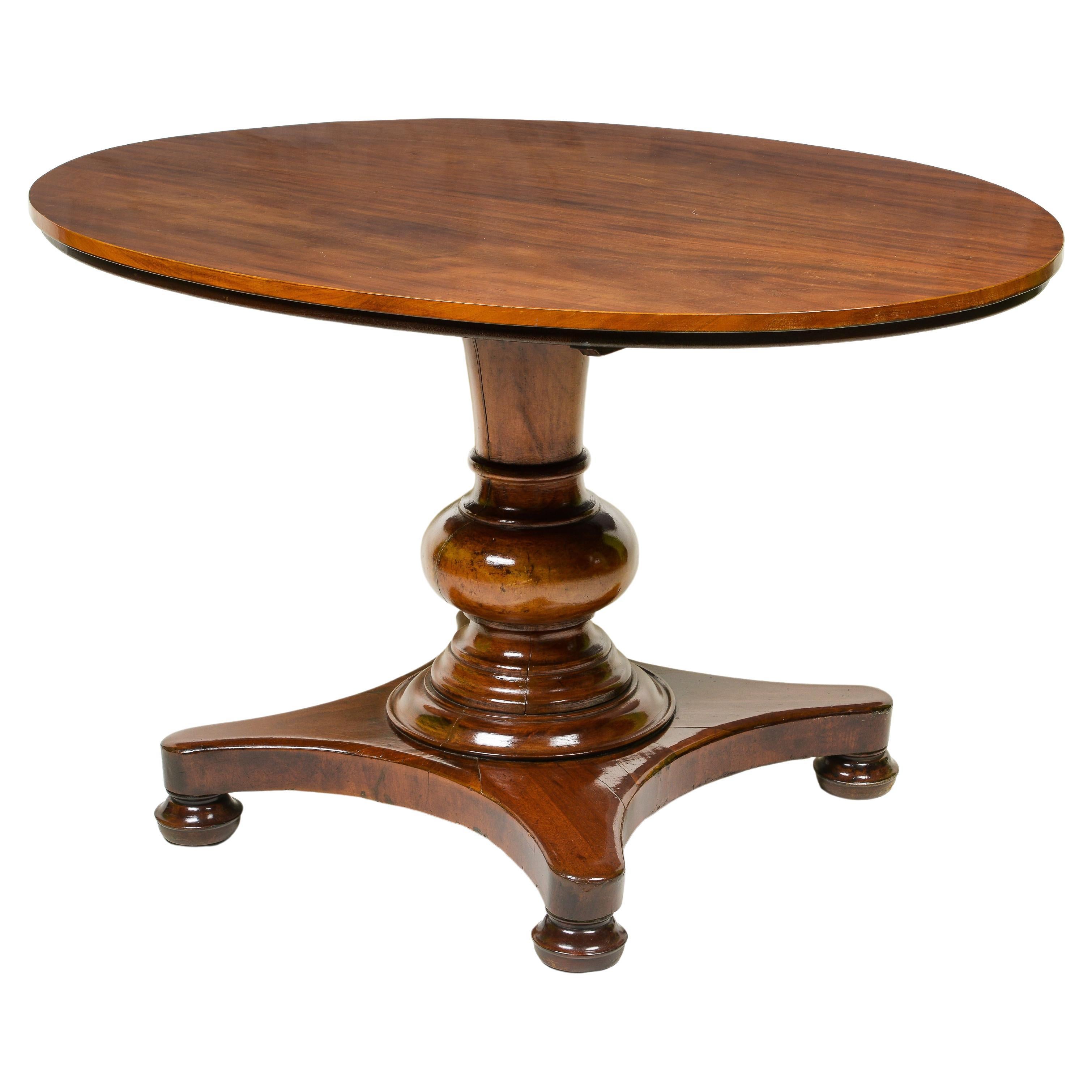A Continental Mahogany Oval Center Table For Sale