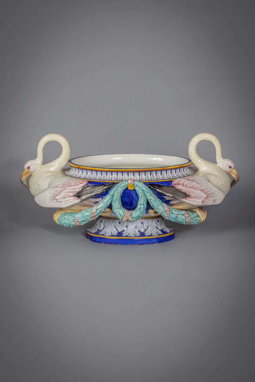 Probably by Villeroy and Boch. Molded at each end with two large pink and cream flamingoes.