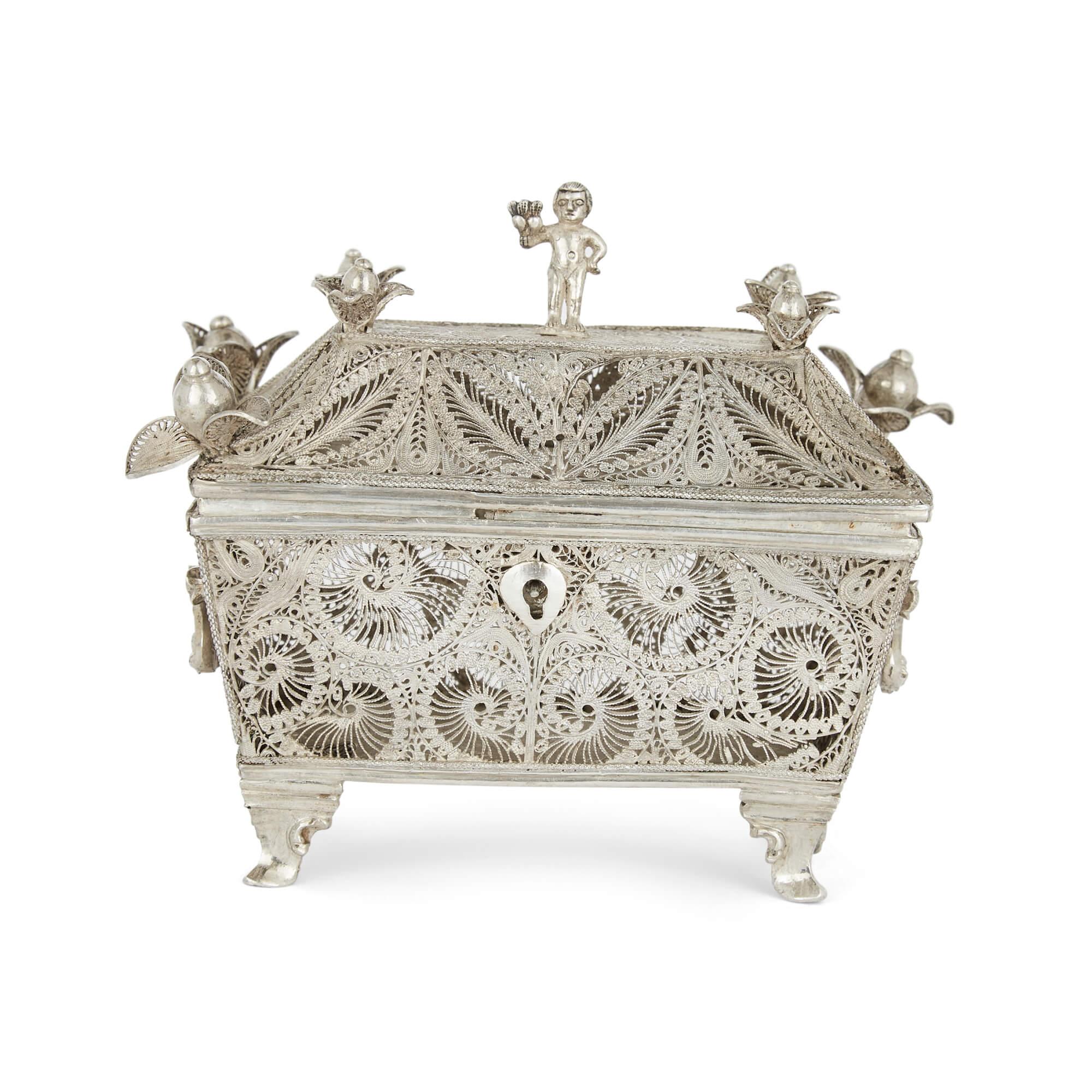 Crafted with superb skill in silver filigree, this beautiful and delicate box is most likely continental-made, dating from the early 20th century. Its exact origin is unclear, and it may have been intended as a spice box, however what is clear is