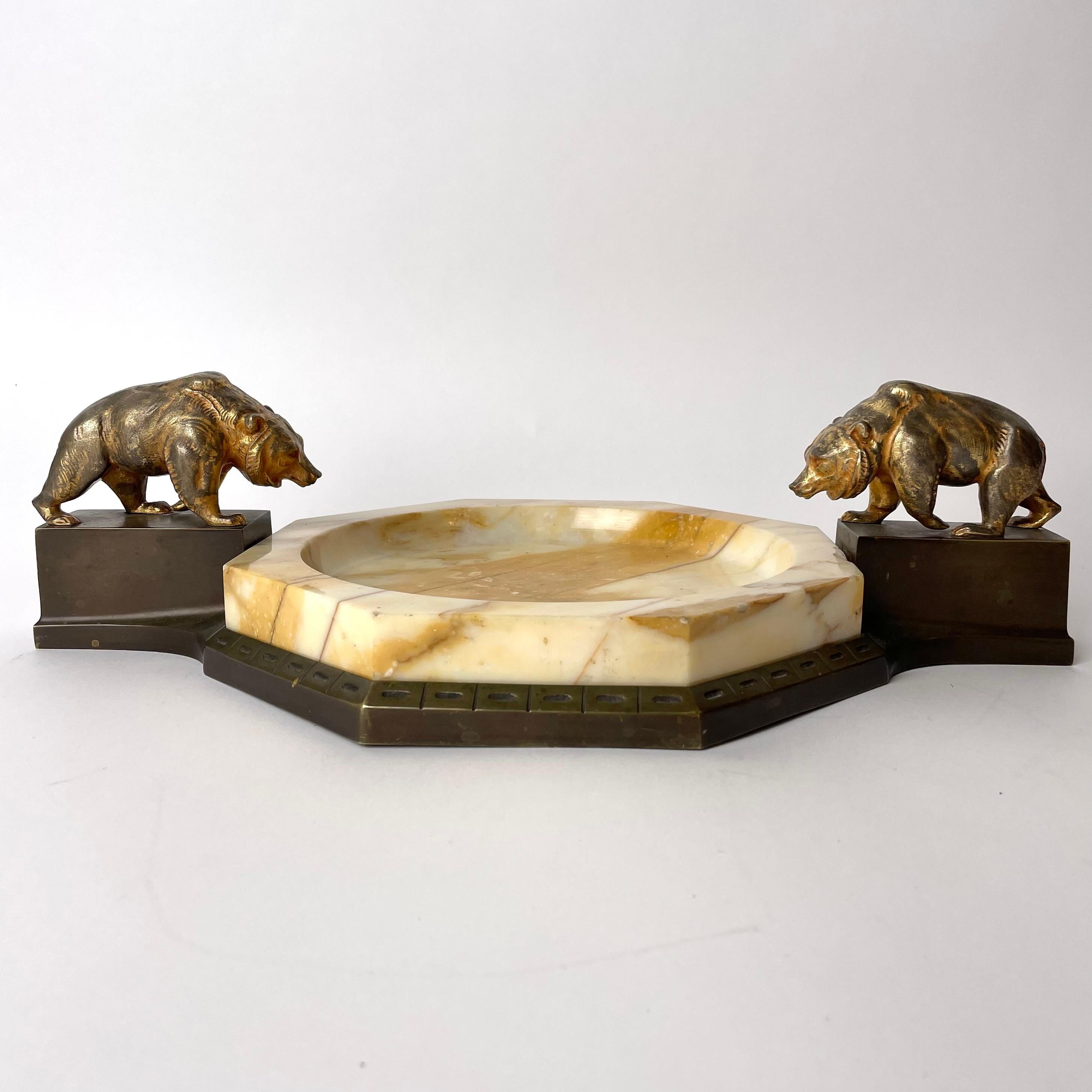 A cool dish in marble and bronze. Beautiful decorated with gilded bears. Art Deco from the 1920s. Worn gilding on the bears.

Wear consistent with age and use.