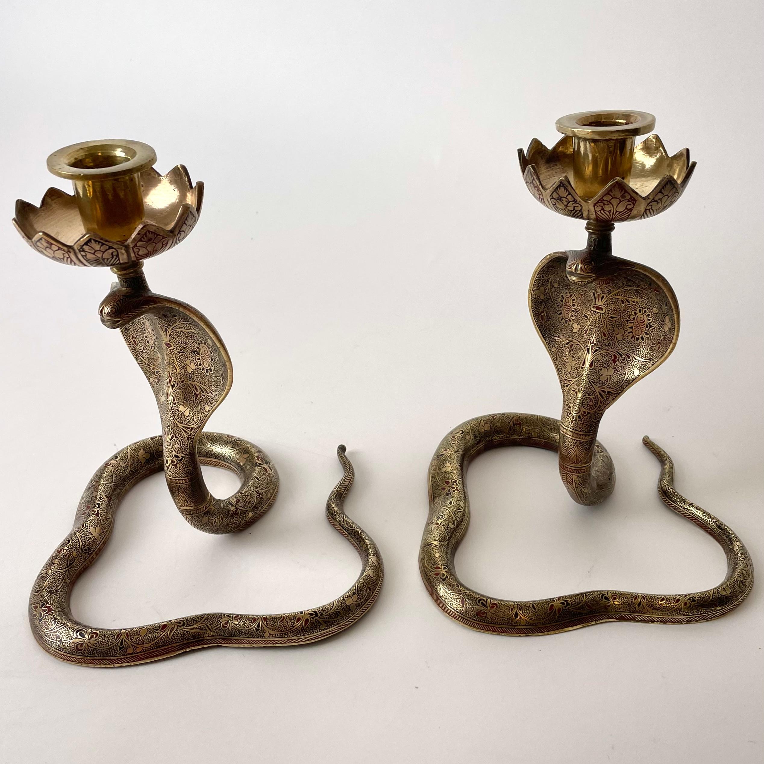 A very cool pair of Brass Cobra Candlesticks. Probably made in India during the 1930s. Fine craftmanship with rich decoration of flowers and leaves.

Wear consistent with age and use.