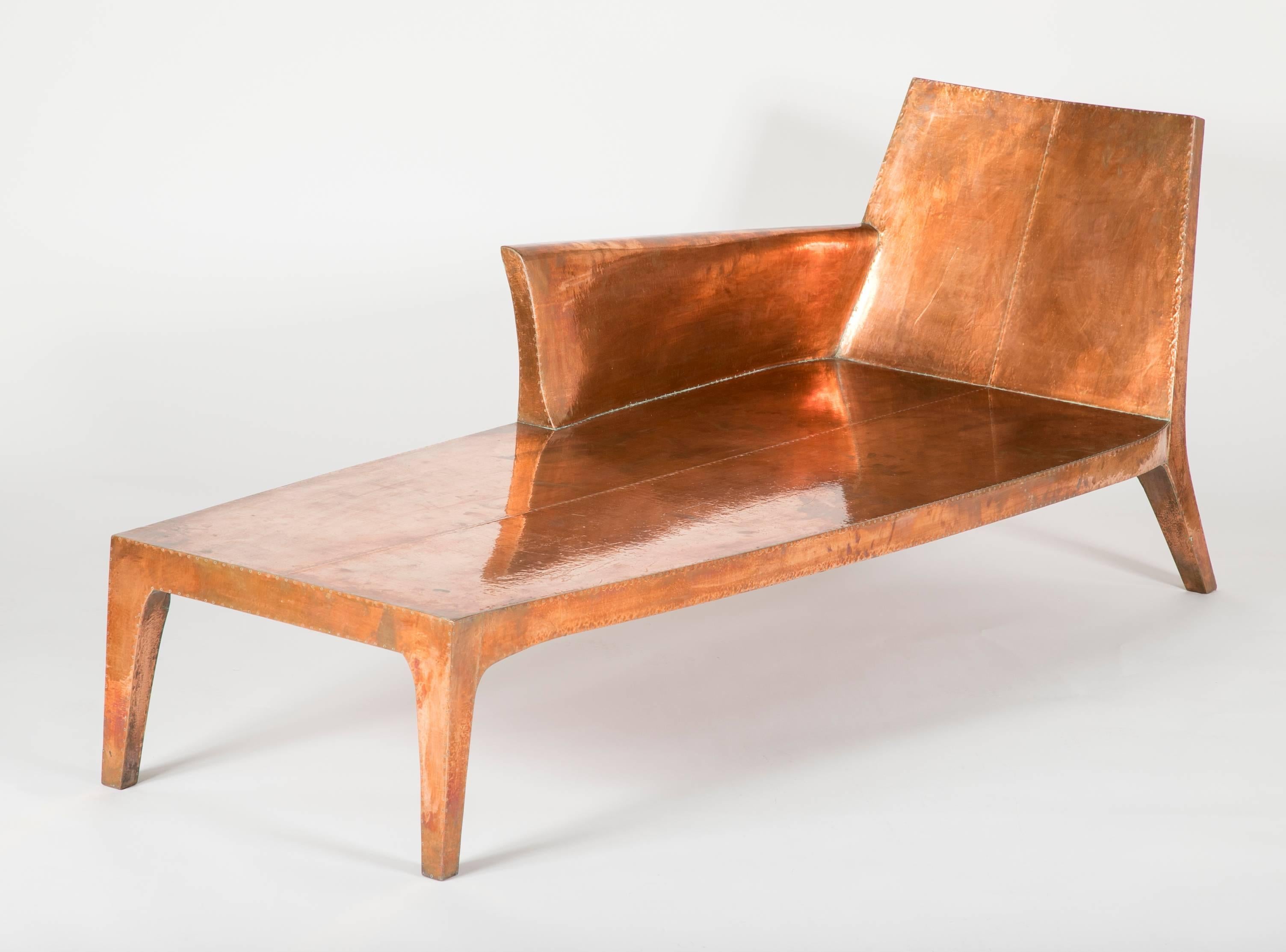 Louise chaise designed by Paul Mathieu for Stephanie Odegard Co. Ltd.  .
Hand-carved teak wood frame clad in copper with nailhead details.