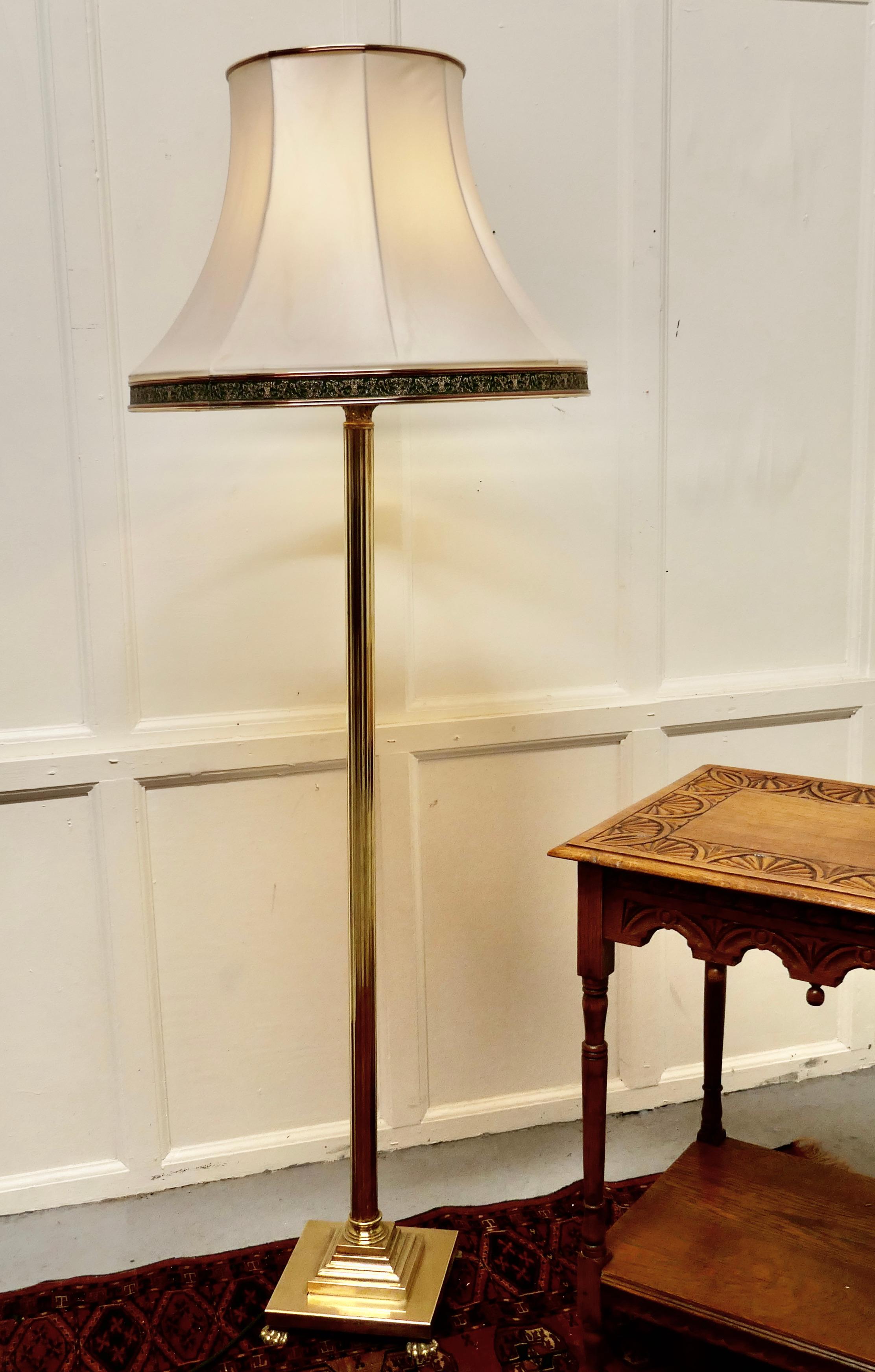A Corinthian column brass floor lamp

A lovely design the stepped square base is set with lion claw feet on each corner, the lamp has a central Corinthian column also in brass
The lamp is in good condition with new wiring it has its original